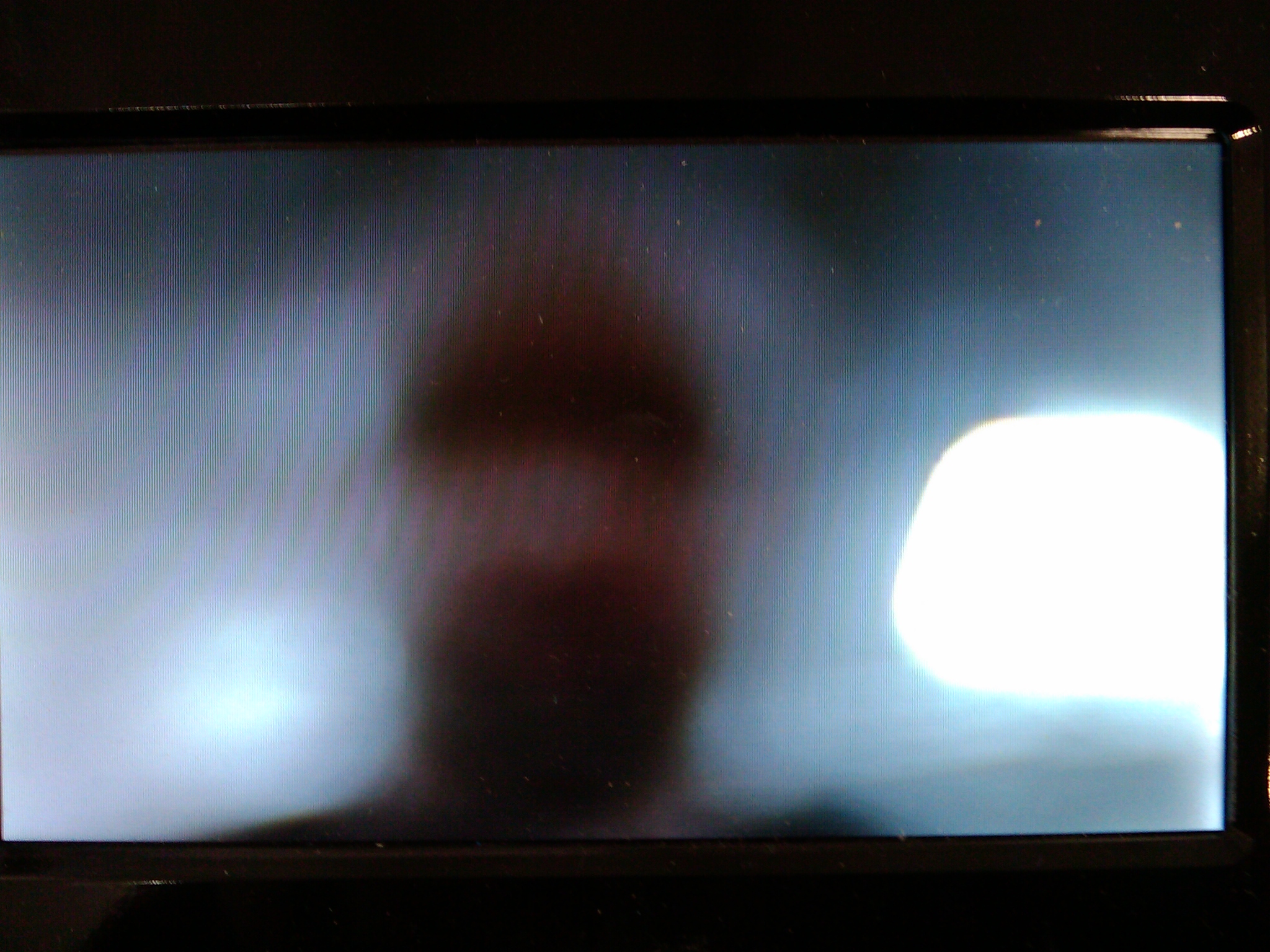 My face on the screen of a karaoke machine with built-in (and out of focus) camera at Costco.