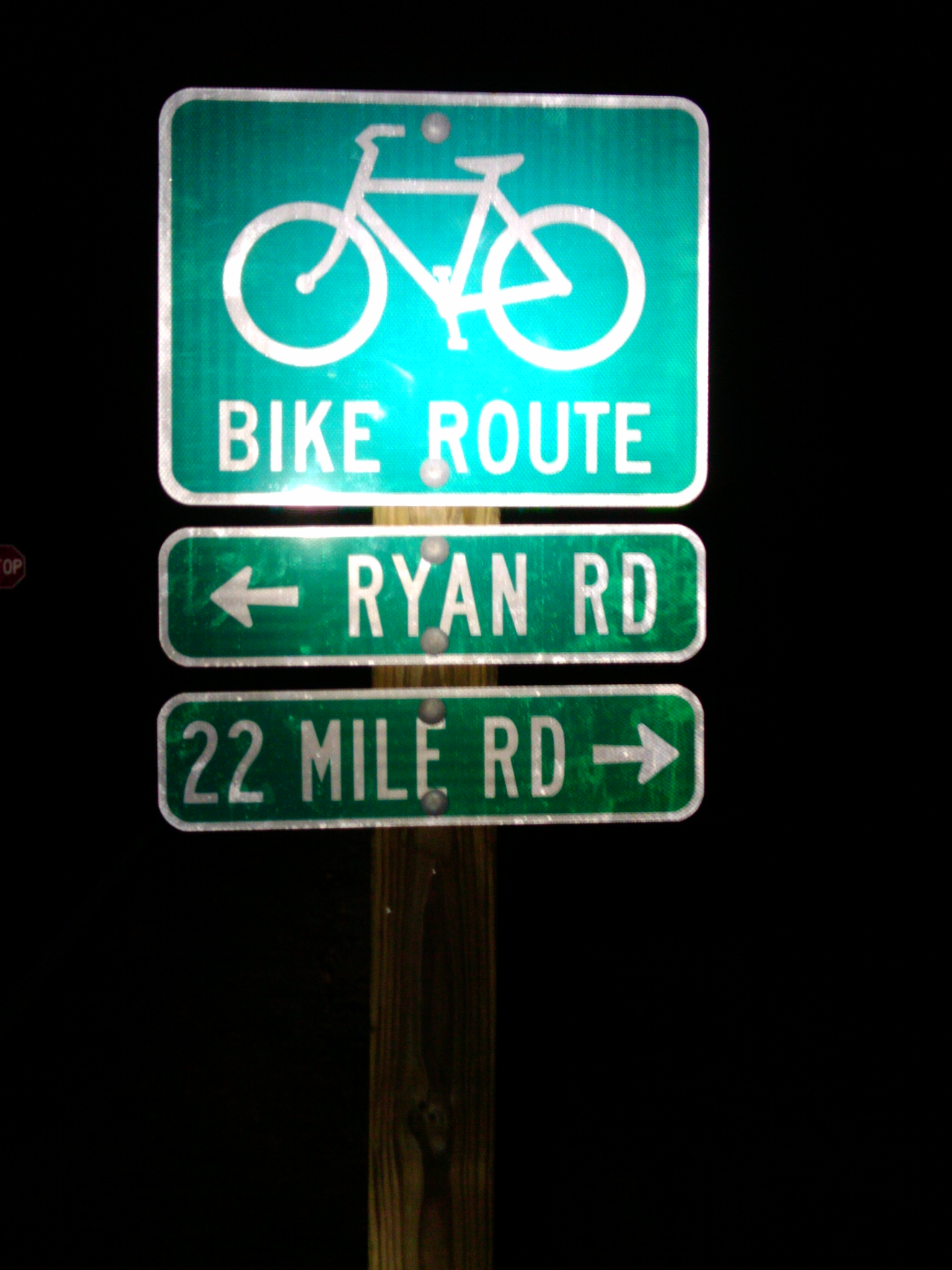 This Bike Route sign in River Bends is seen when coming from a loop of path/trail. There is another sign in the opposite direction indicating that the dead end loop is a bike route.