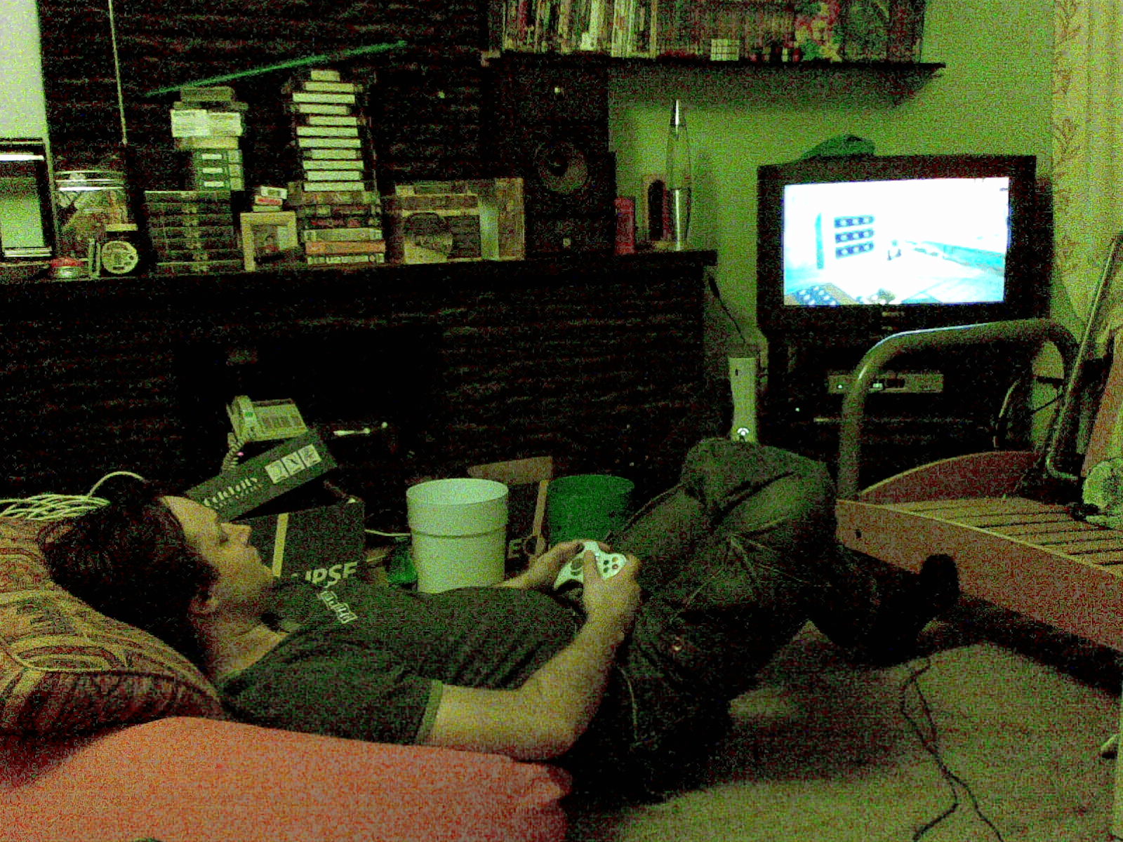 Dominic reclining on a bean bag chair playing Lego Star Wars.