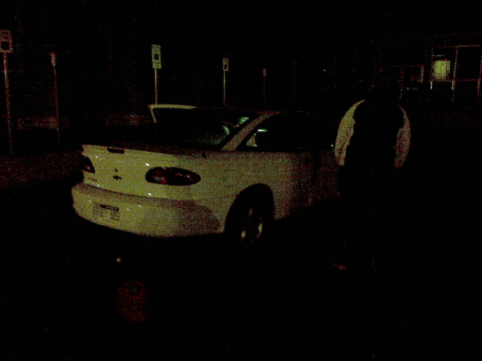 Danielle standing outside of her car after we filled it with fuel. A failing gas gauge caused her to run out.
