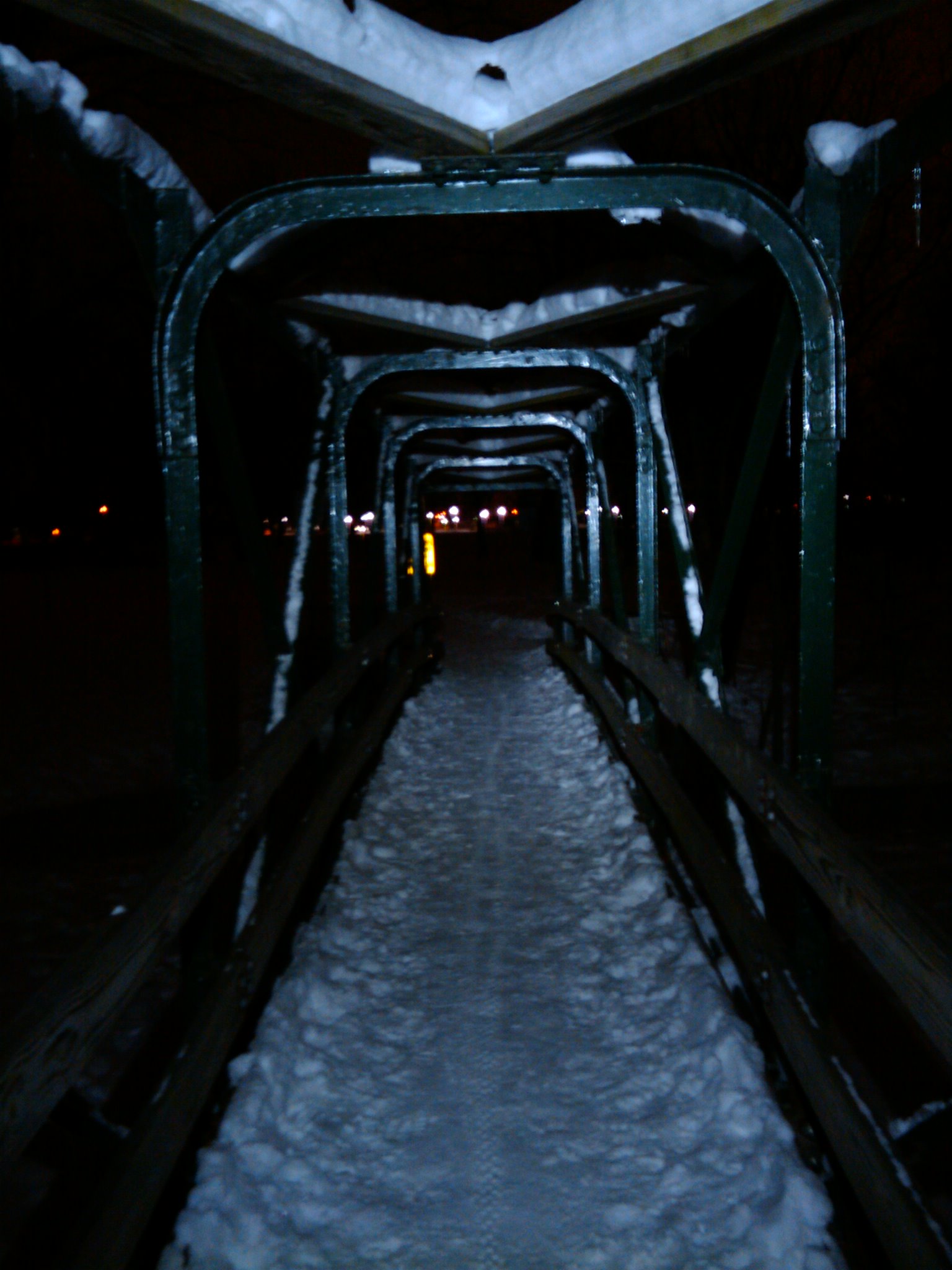 Crossing back over the bridge from Clinton River Park to Dodge Park after a winter evening ride with Bob.