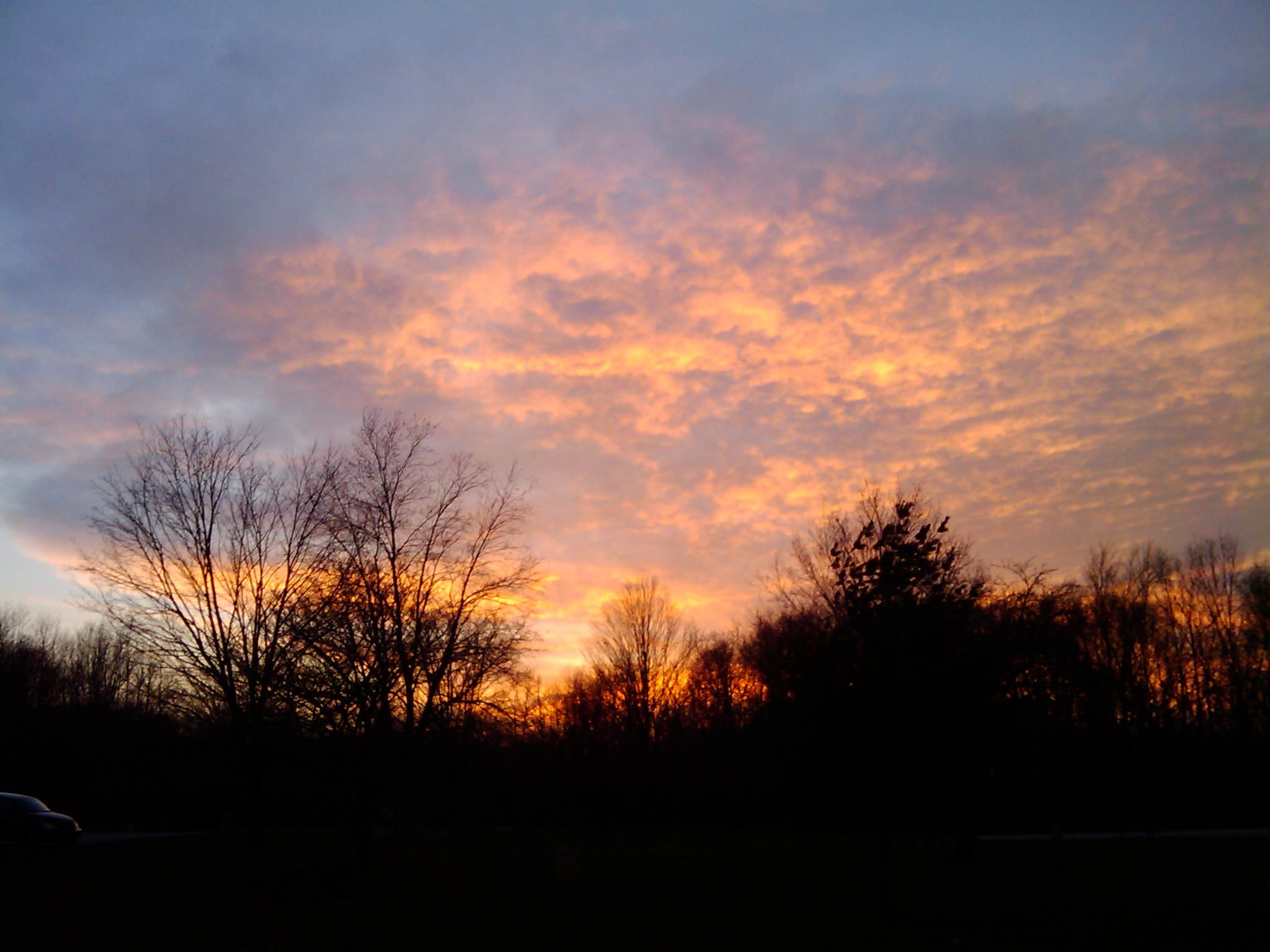Sunset at Stony Creek, seen from the West Branch Parking Lot A, after a nice evening of riding.