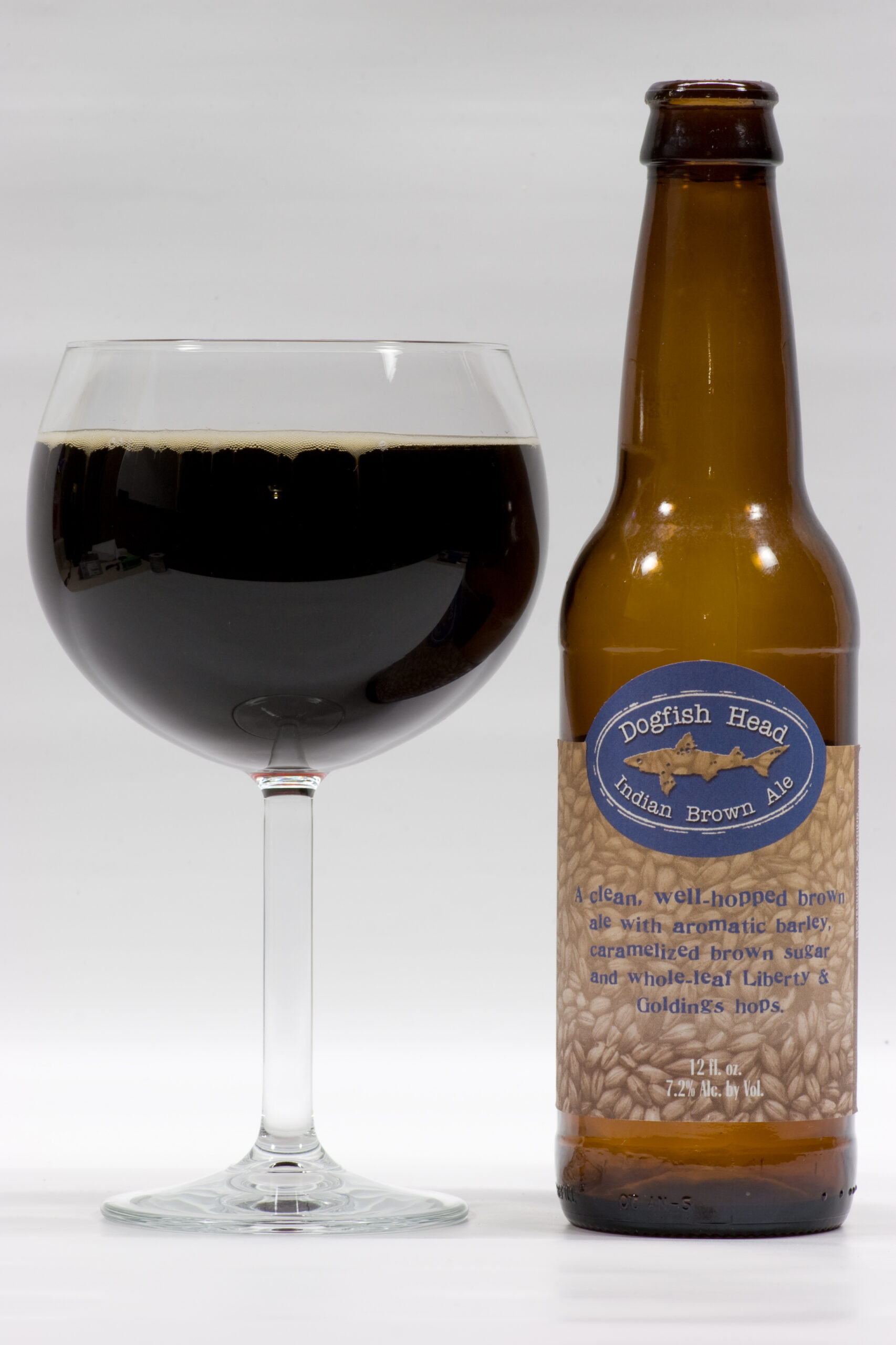 Dogfish Head's Indian Brown Ale poured into a glass. This is a nice, strong, malty, hoppy brown ale.