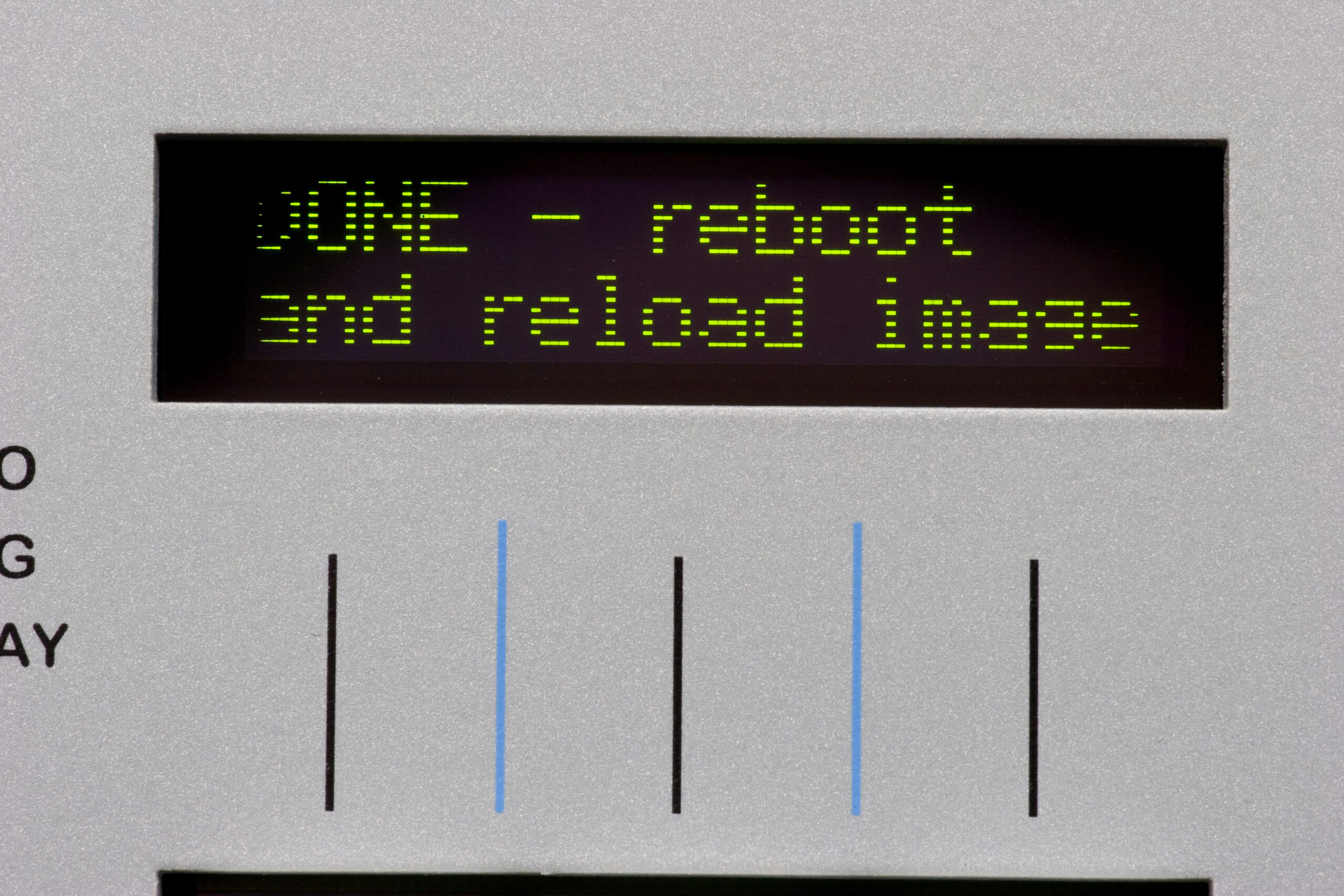 Two lines of display on the failing PLED during bootloader update. Note that the second line is more faint than the first, pixels are smaller than expected, and there is distinct fading around the edges of the display.