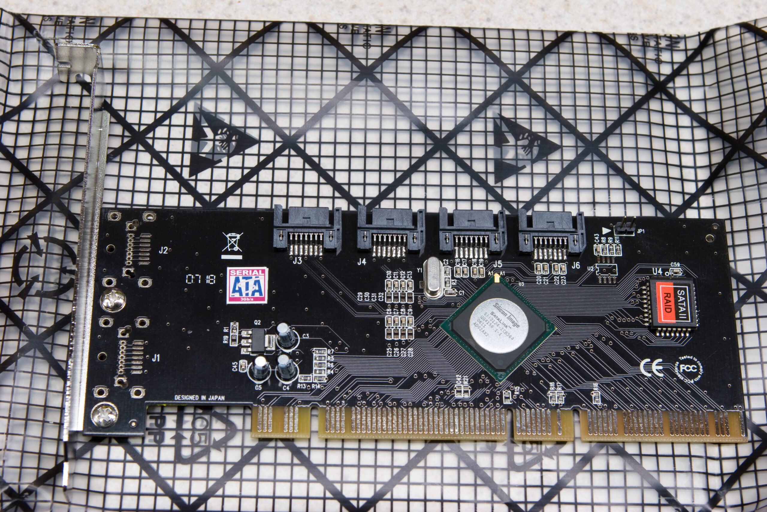 Top view of the Koutech PSA421 on the antistatic bag. It has four internal single lane SATA ports.