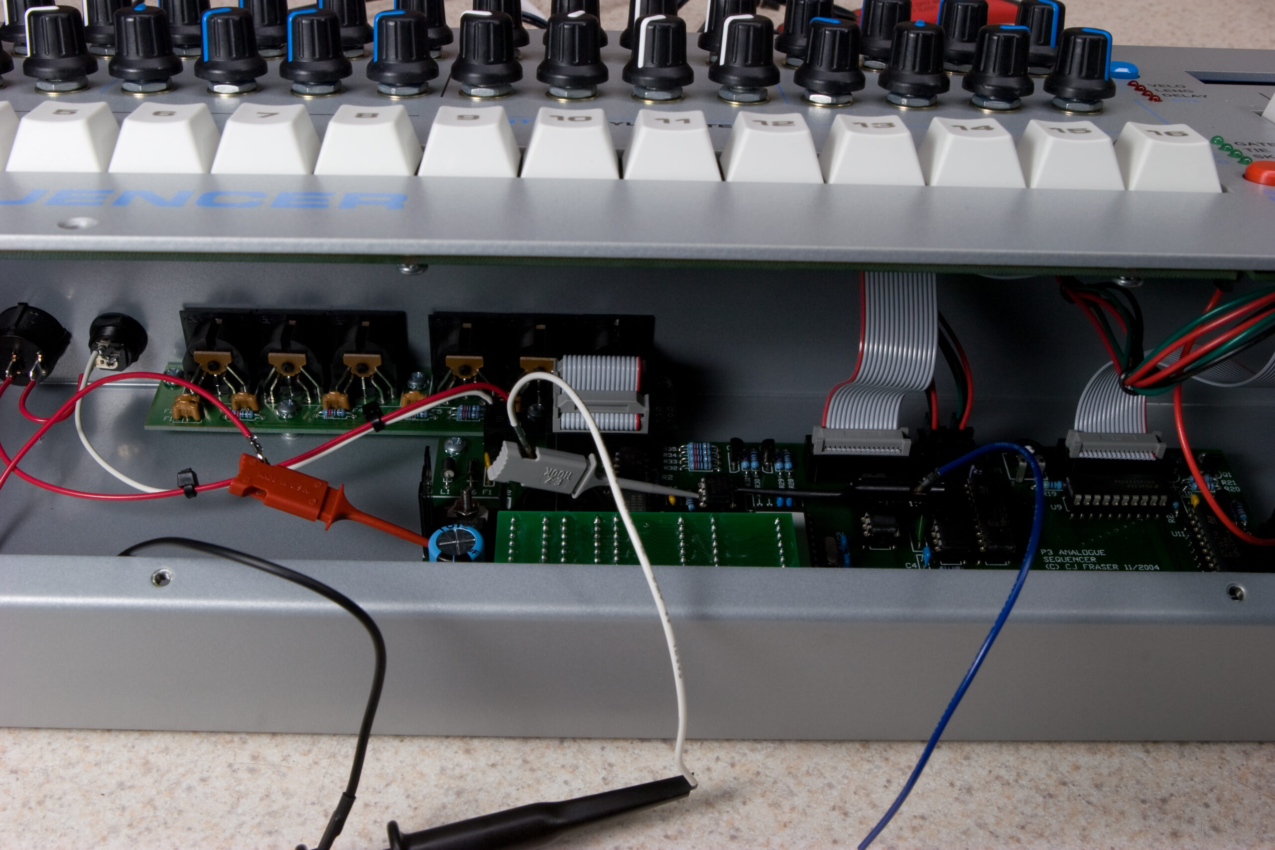 Looking inside of Ivan's P3 while the micro grabbers are connected to ground, sync in (to the PIC on GP4), and what should be MIDI out (from the PIC on GP0).
