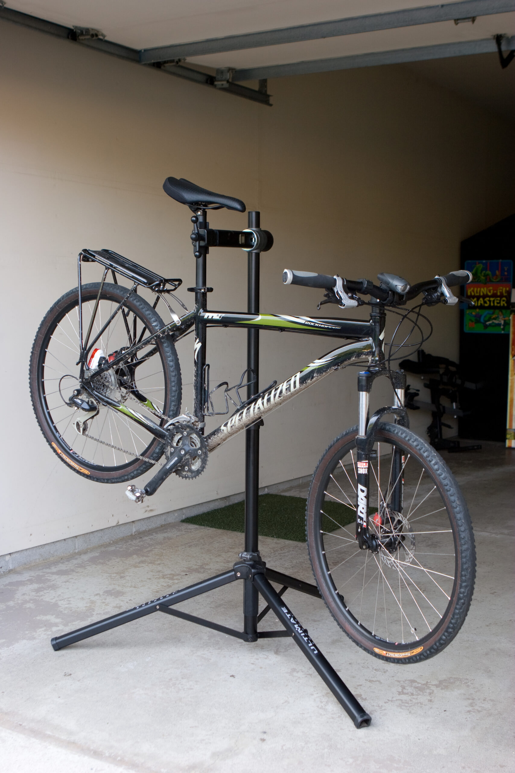 I purchased this Ultimate Support Sport-Mechanic bike repair stand from REI to hold my bike while working on it. It's quite useful.