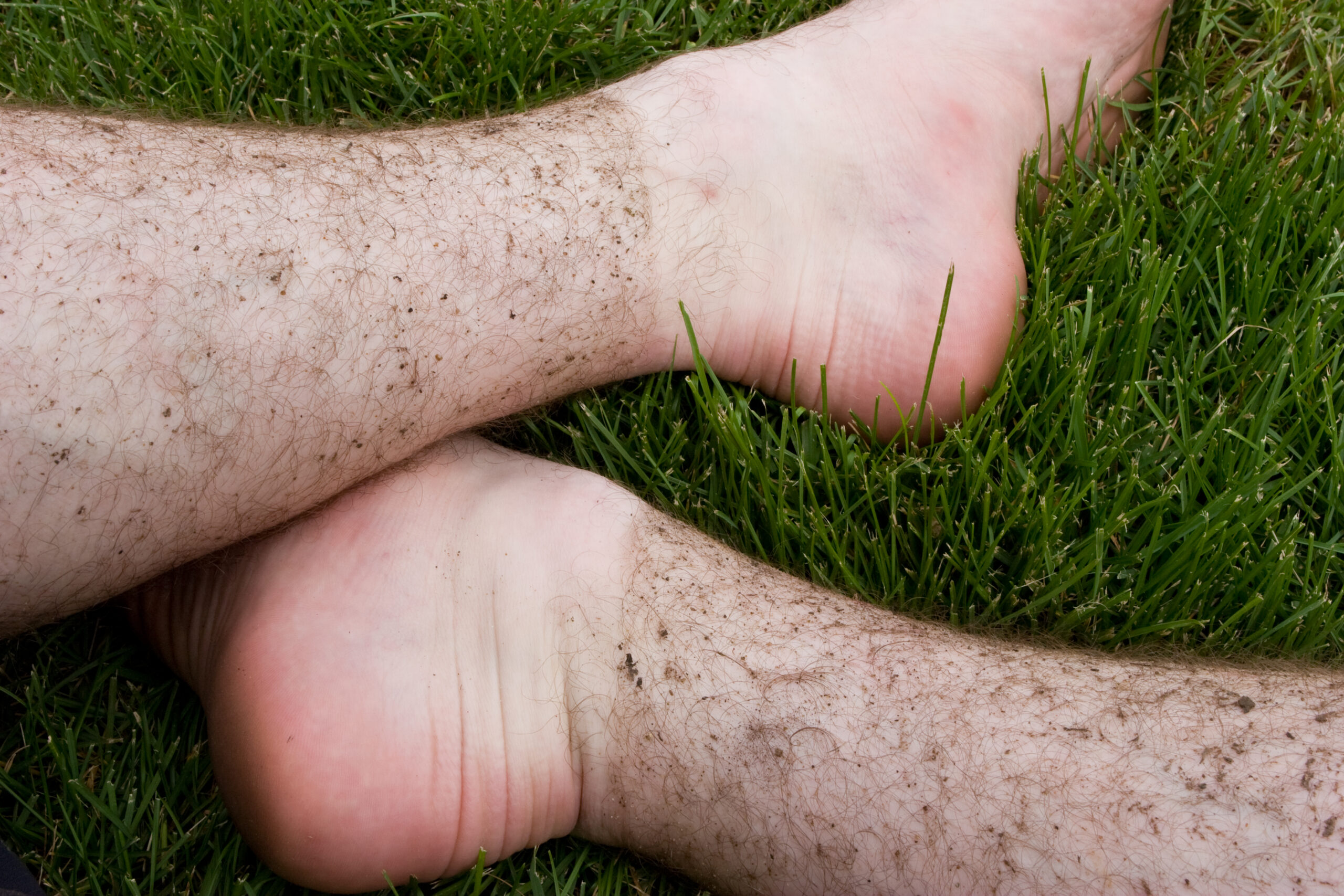 My legs with dirt lines after they spent a while being sprayed with mud, dirt, and water at River Bends while trying out The Captain Control tires.