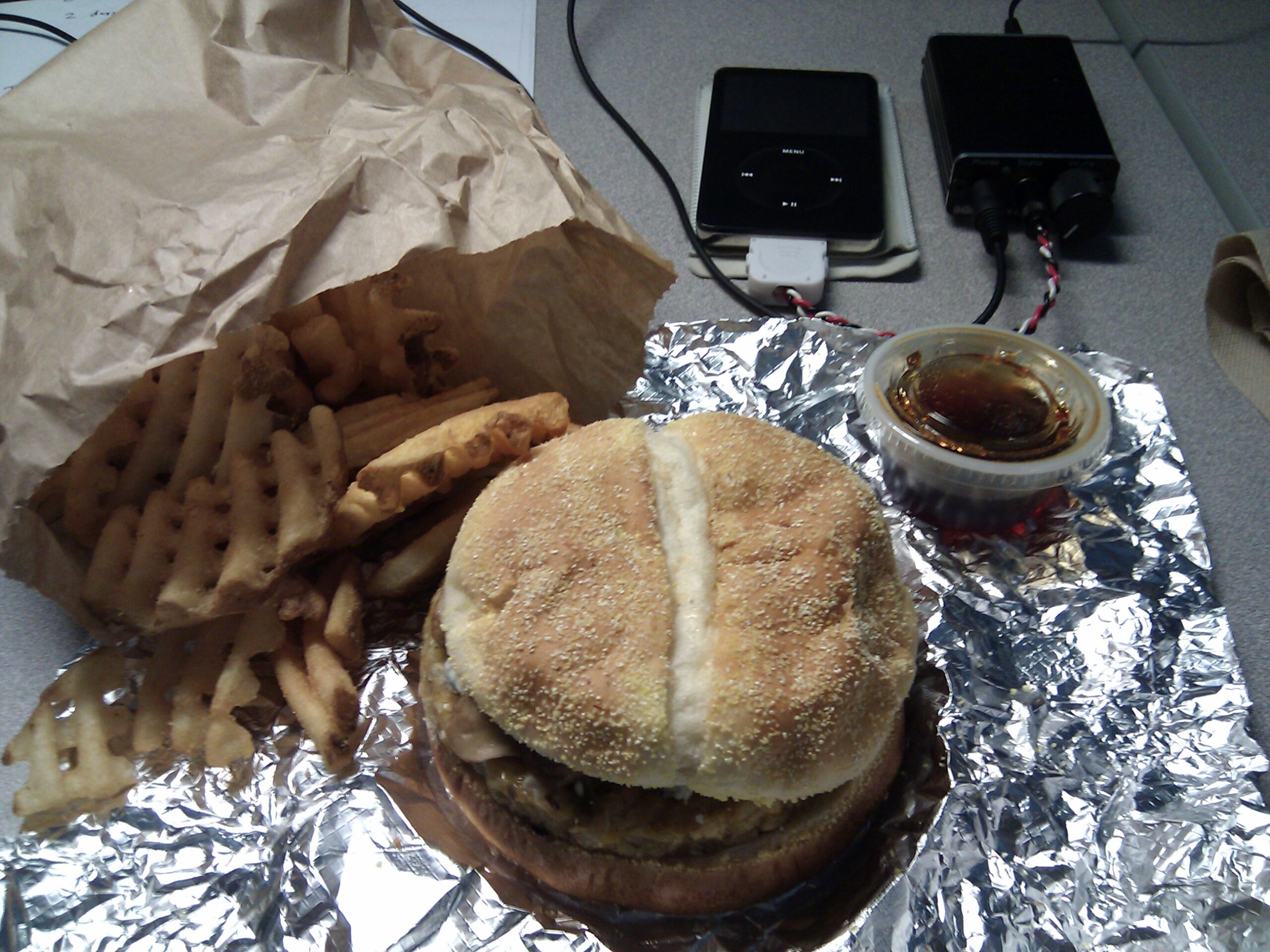 Waffle fries, veggie burger with sautéed mushrooms and blue cheese, and home-made zip sauce from Burgrz in Rochester Hills, MI.