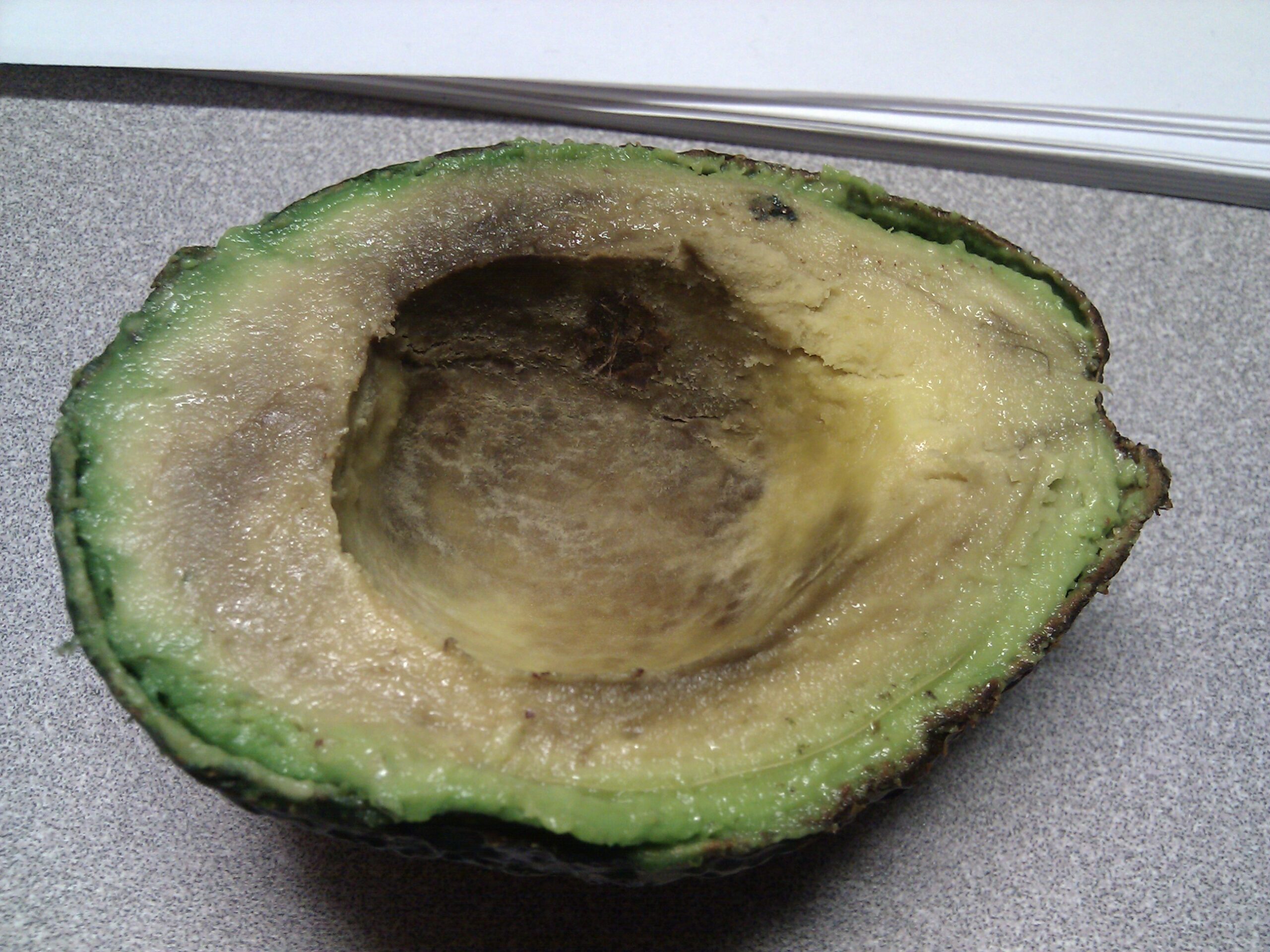 Avocado, purchased yesterday from Whole Foods, found to be bad once opened up to eat for breakfast. It was stringy, discolored, and salty tasting.