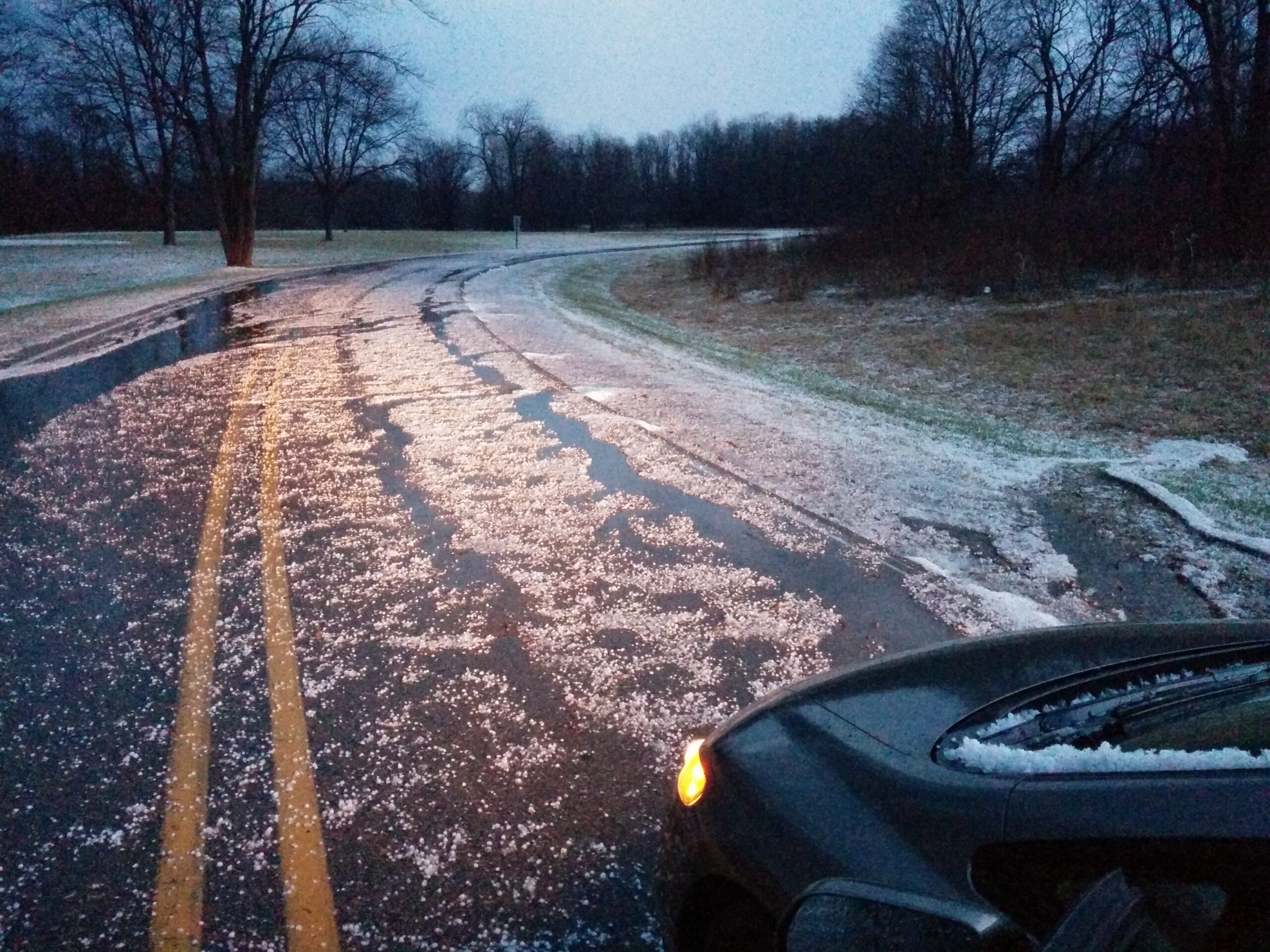 Hail in the West Branch driveway at Stony Creek after getting caught in a storm with JD Harvey (looking past front of car).