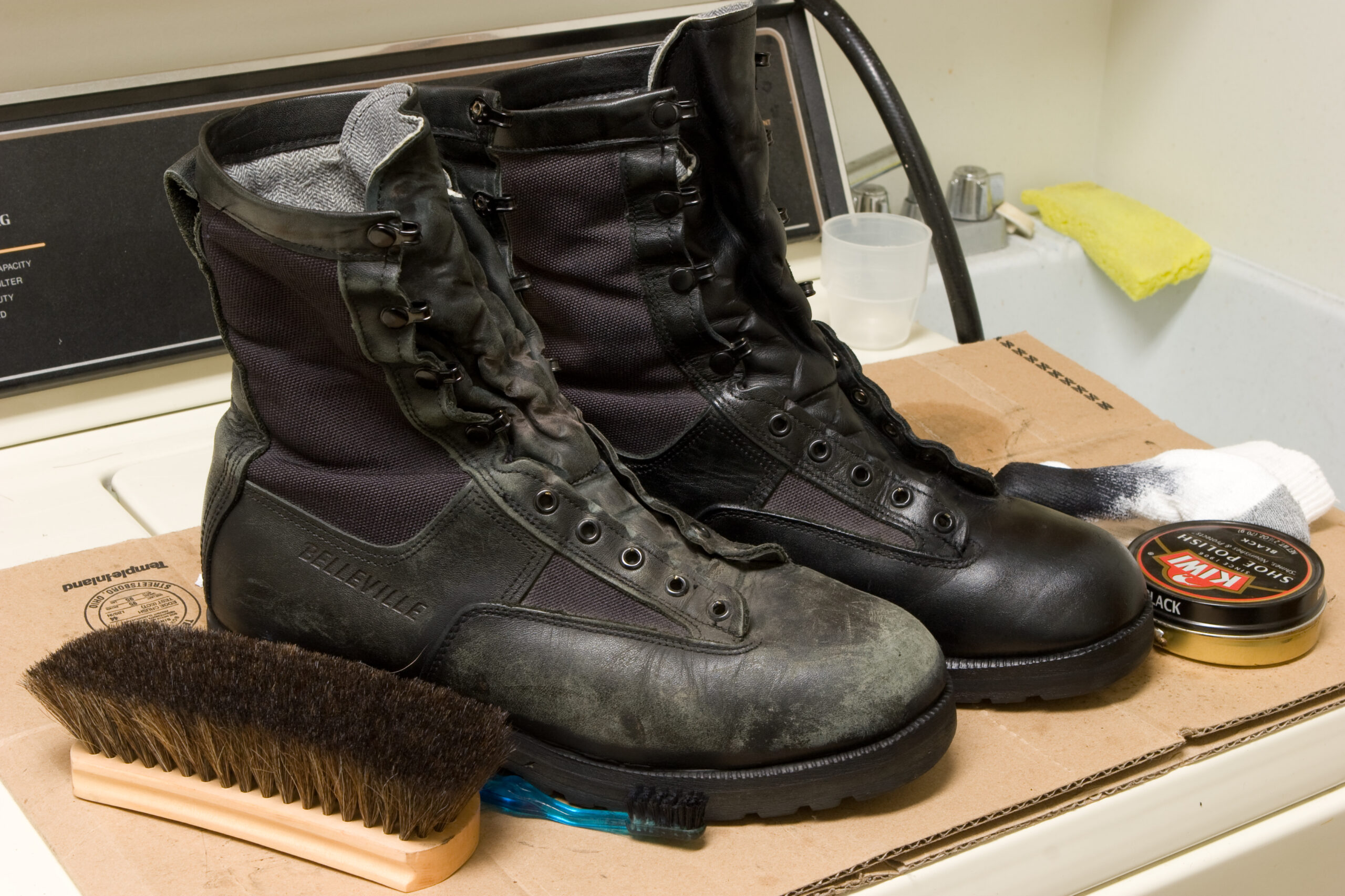 Set up to polish my boots in the laundry room. One boot is done.