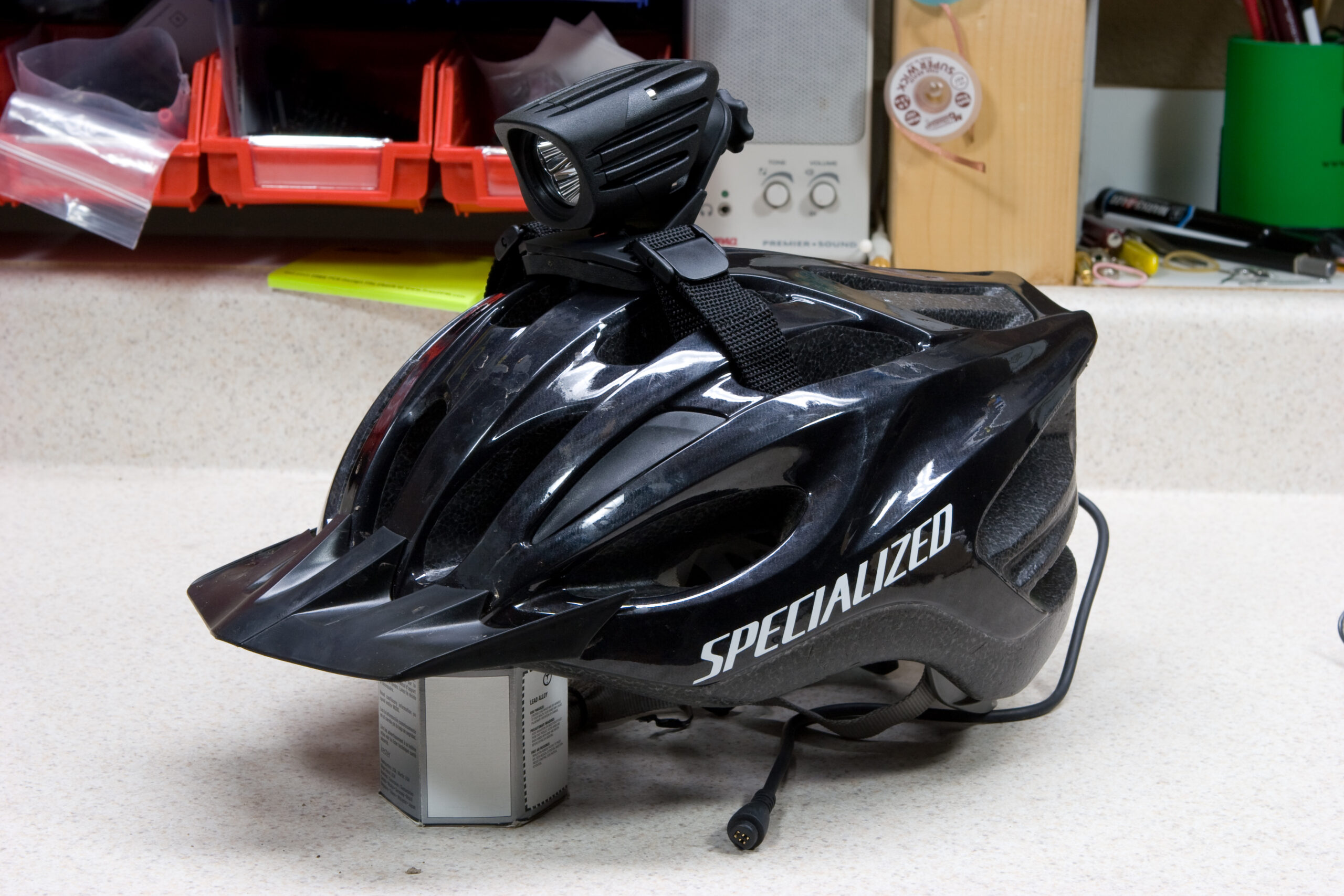 NiteRider TriNewt mounted on my helmet. It's a bit heavy, but should work well.