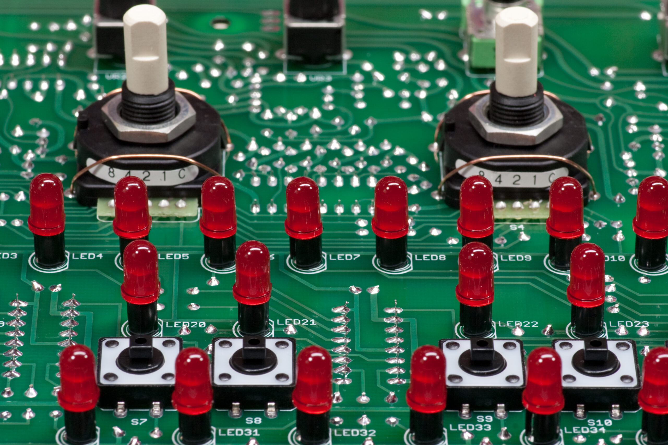 Top of the finished mainboard PCB for x0xb0x #888, showing the mode and bank selector switches, red LEDs, and tactile switches.