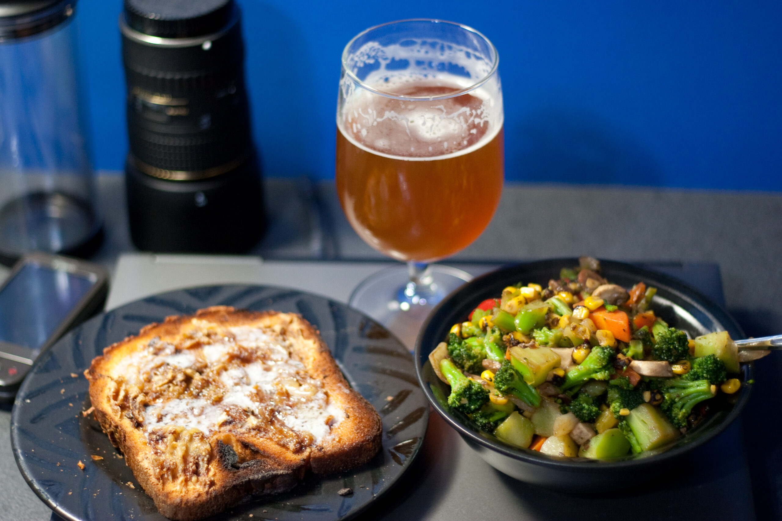Hastily assembled (and photographed) veggie stir fry, roasted garlic and butter on toast, and Bell's Two Hearted.