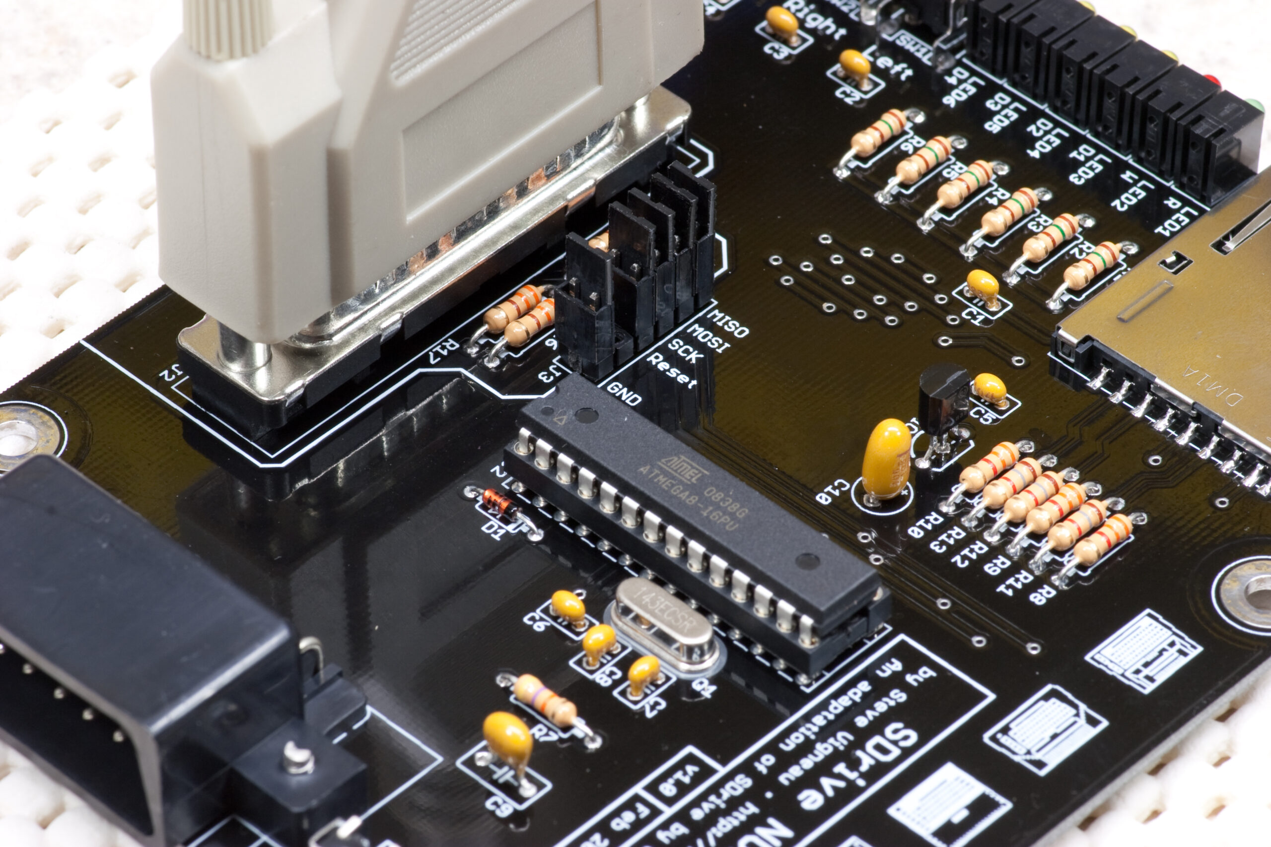 Completed board, connected via a M-M DB25 cable to a PC, for programming.