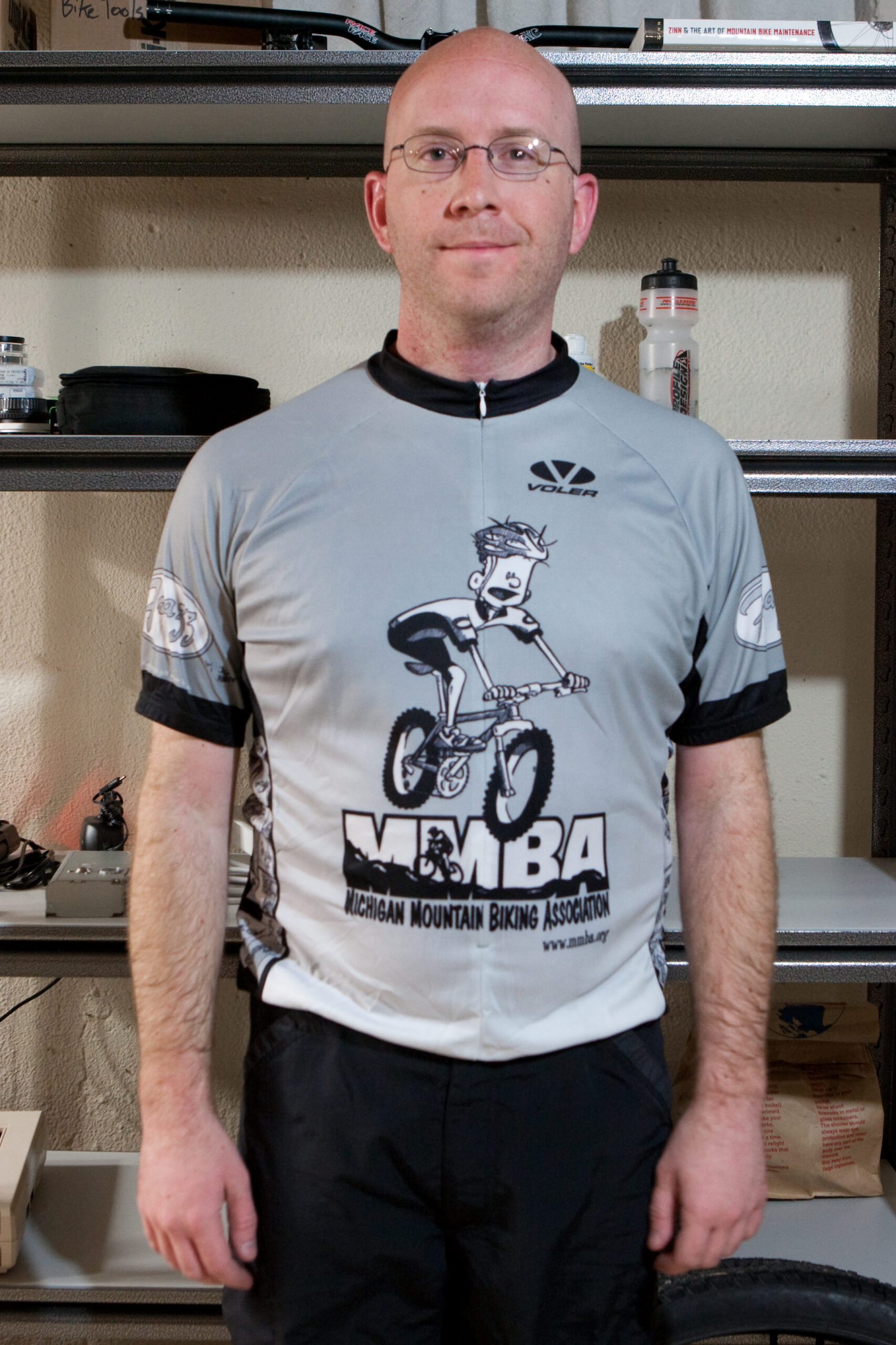 Standing in the basement, very sweaty, wearing an MMBA jersey after my first longish bike ride of the year (36 miles).