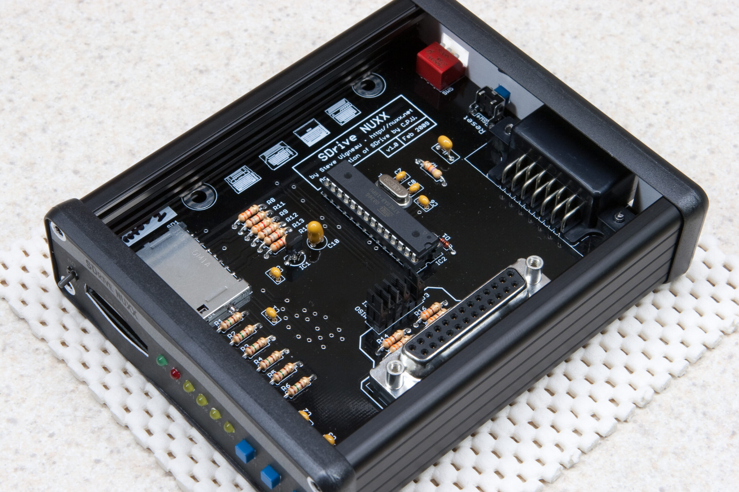 Prototype 1 PCB (v1.0) in the enclosure with v1.0 end panel artwork.