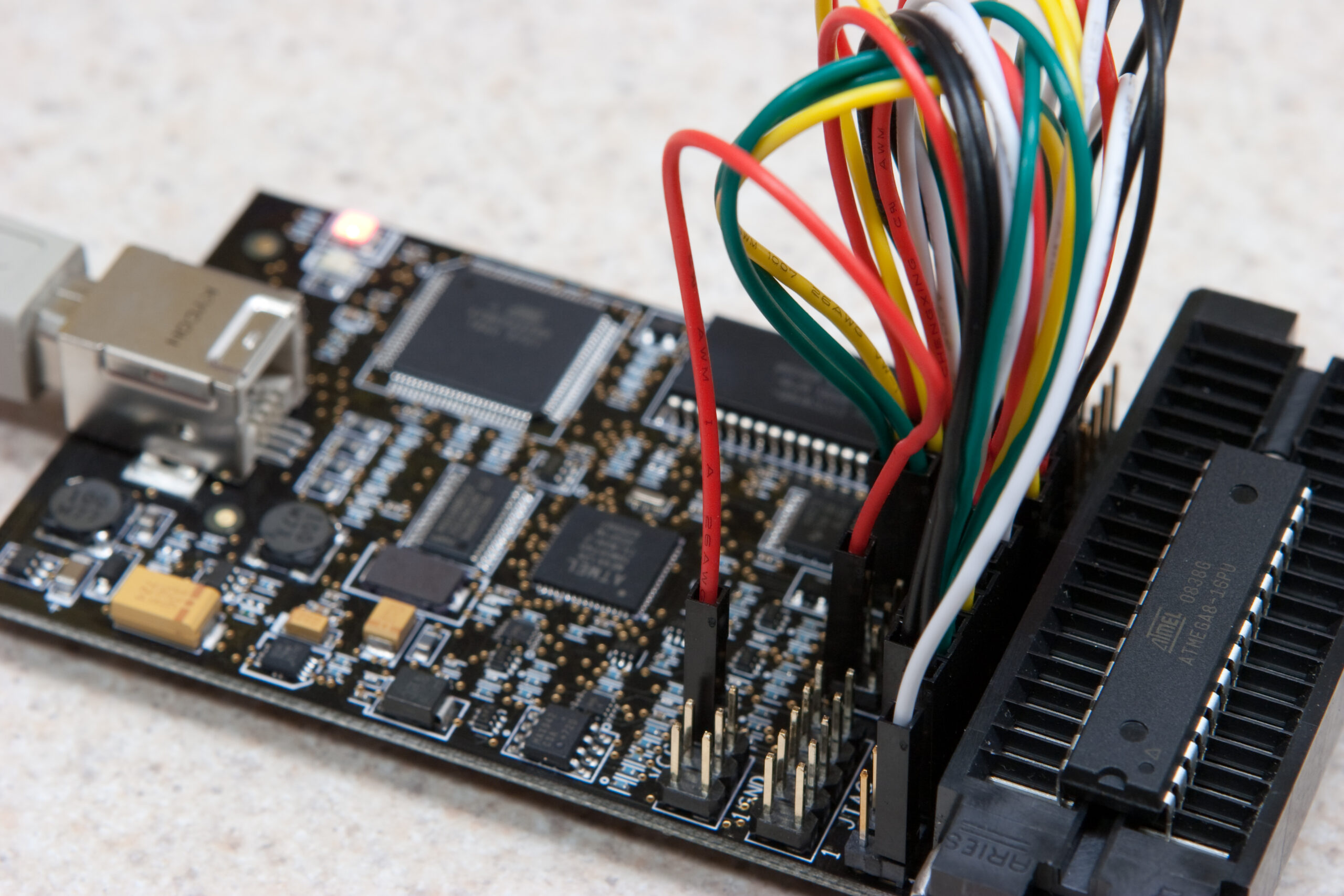 AVR Dragon jumpered for HVPP (High Voltage Parallel Programming) with an ATMEGA8-16PU in the ZIF socket.