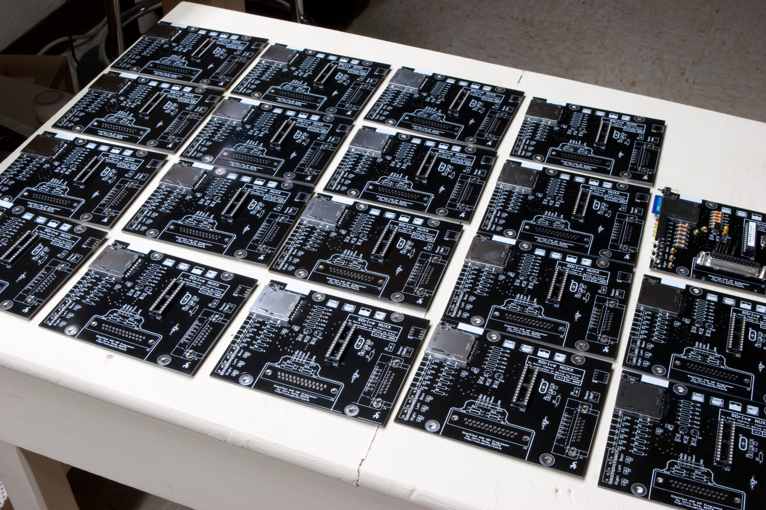 Nineteen SDrive NUXX PCBs being assembled.