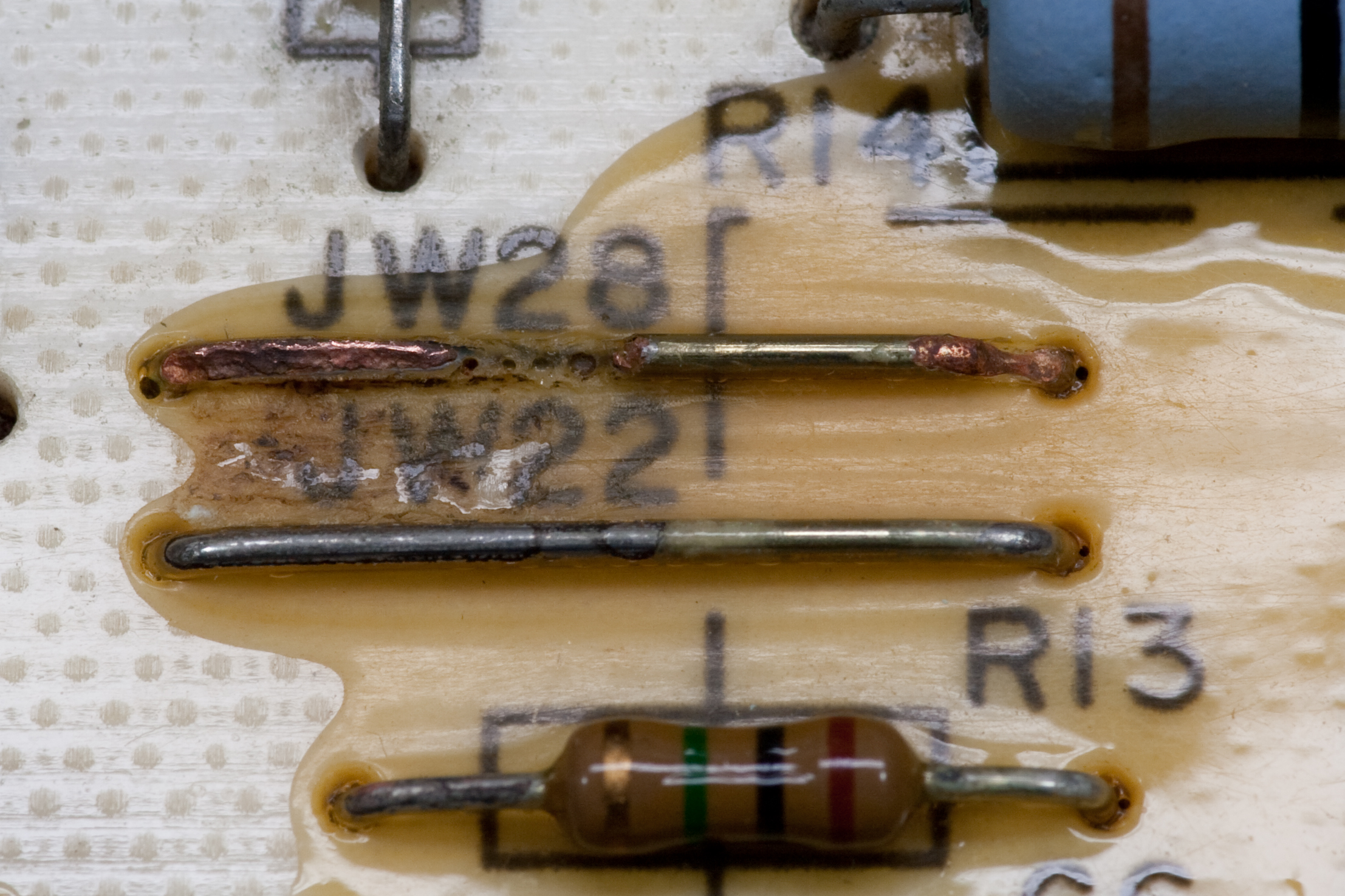 Corroded jumper wire JW28 on the top-side of my coworker Brian's Bryant furnace control board CES0110057-01.
