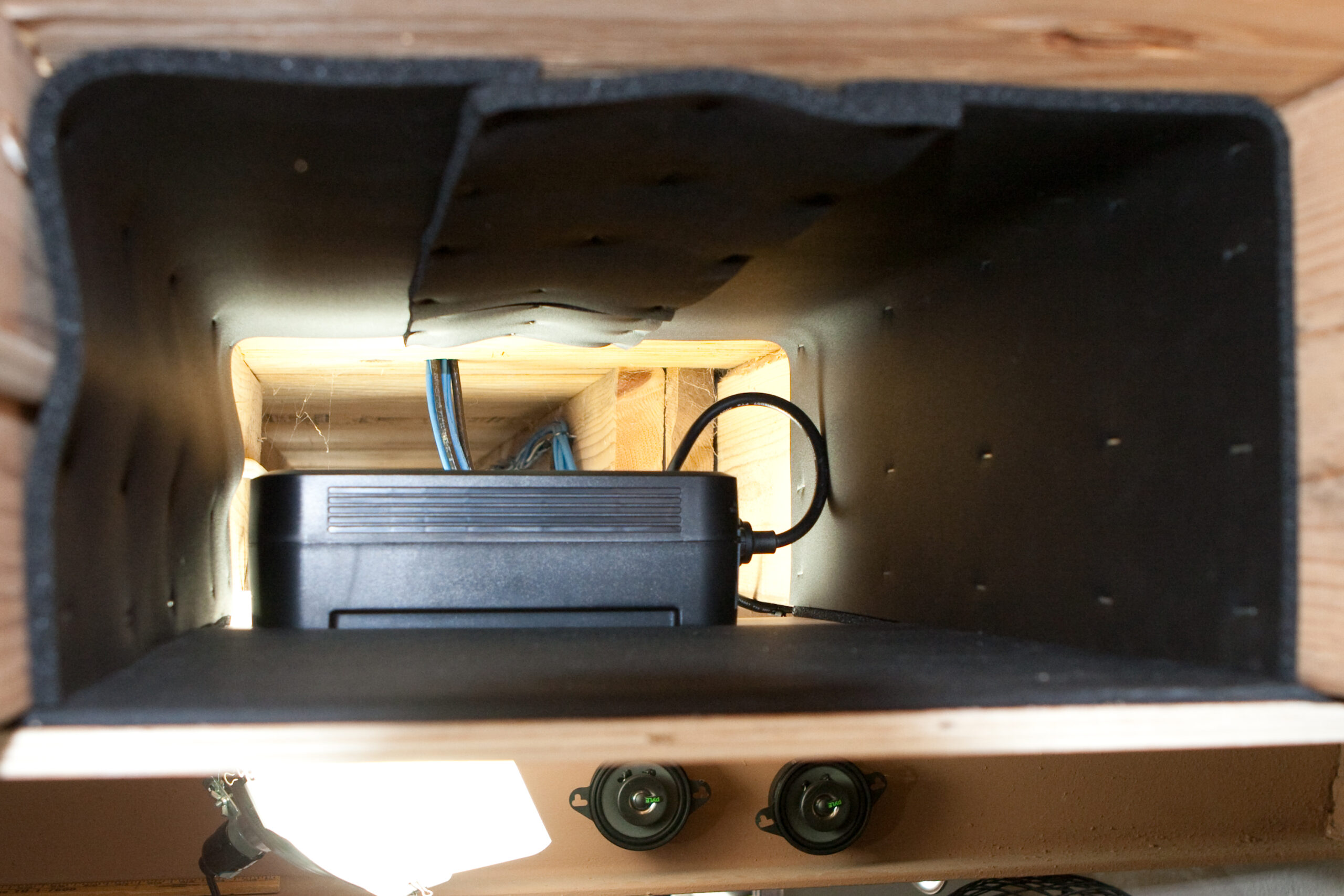 Looking inside the neoprene-lined shelf. The UPS sits at the far end, and the disks will sit on the neoprene, which will hopefully make them inaudible elsewhere in the house.