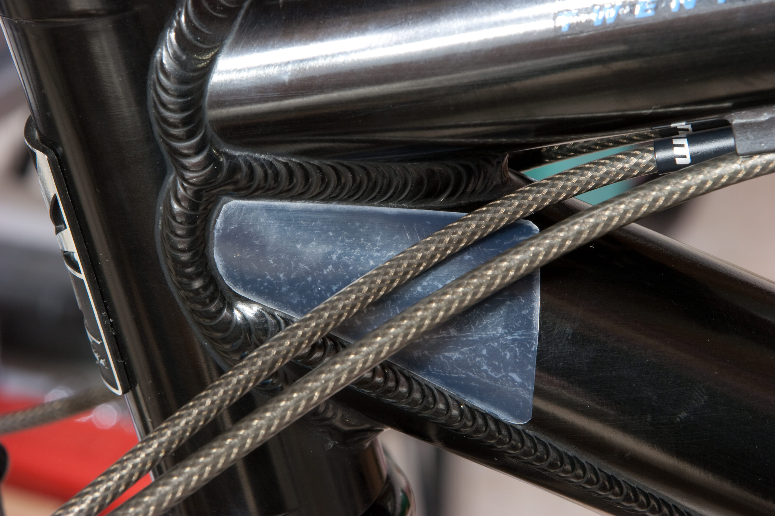 UHMW tape on the left front of the down tube to protect against cable rub.