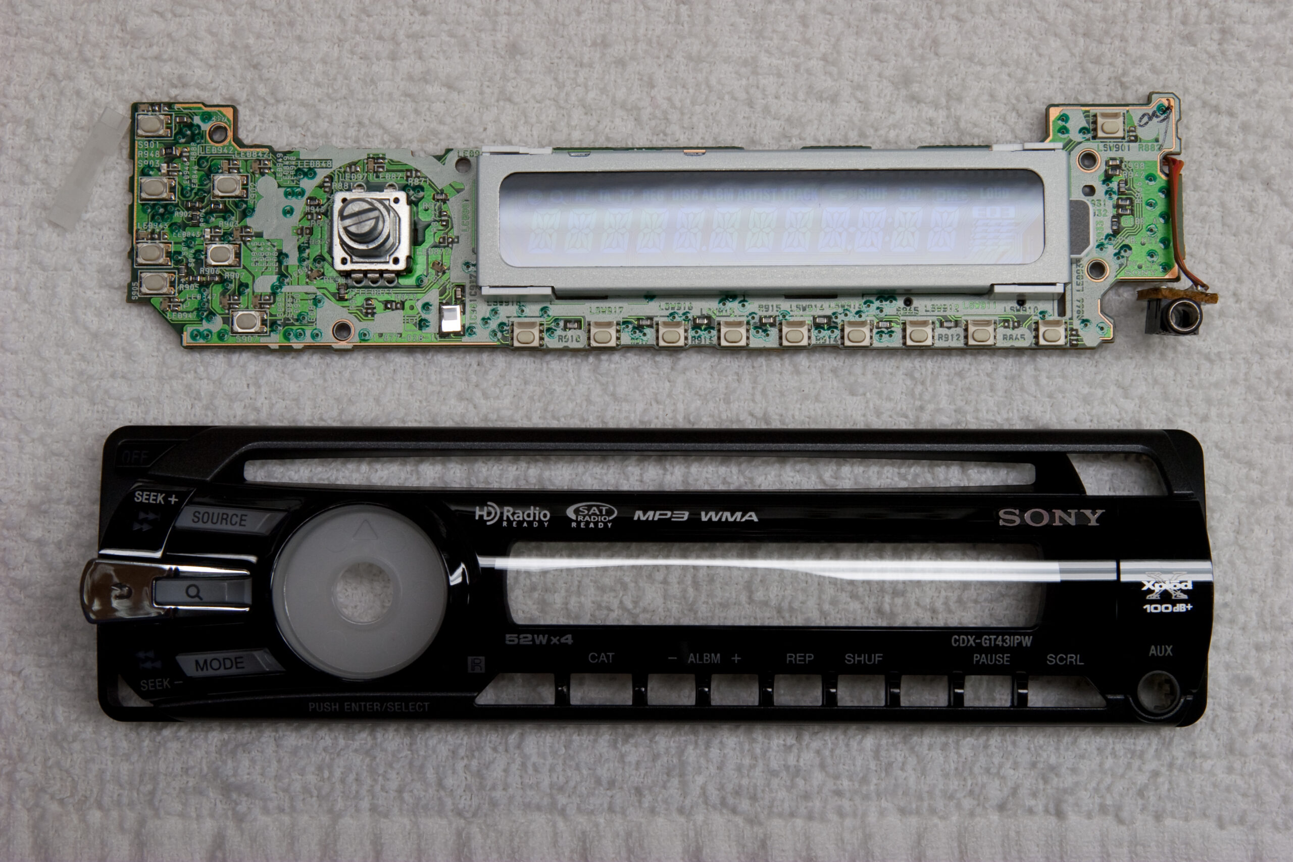 Sony CDX-GT43IPW faceplate front plastic and PCB just before removing some LEDs to make it less glaring.