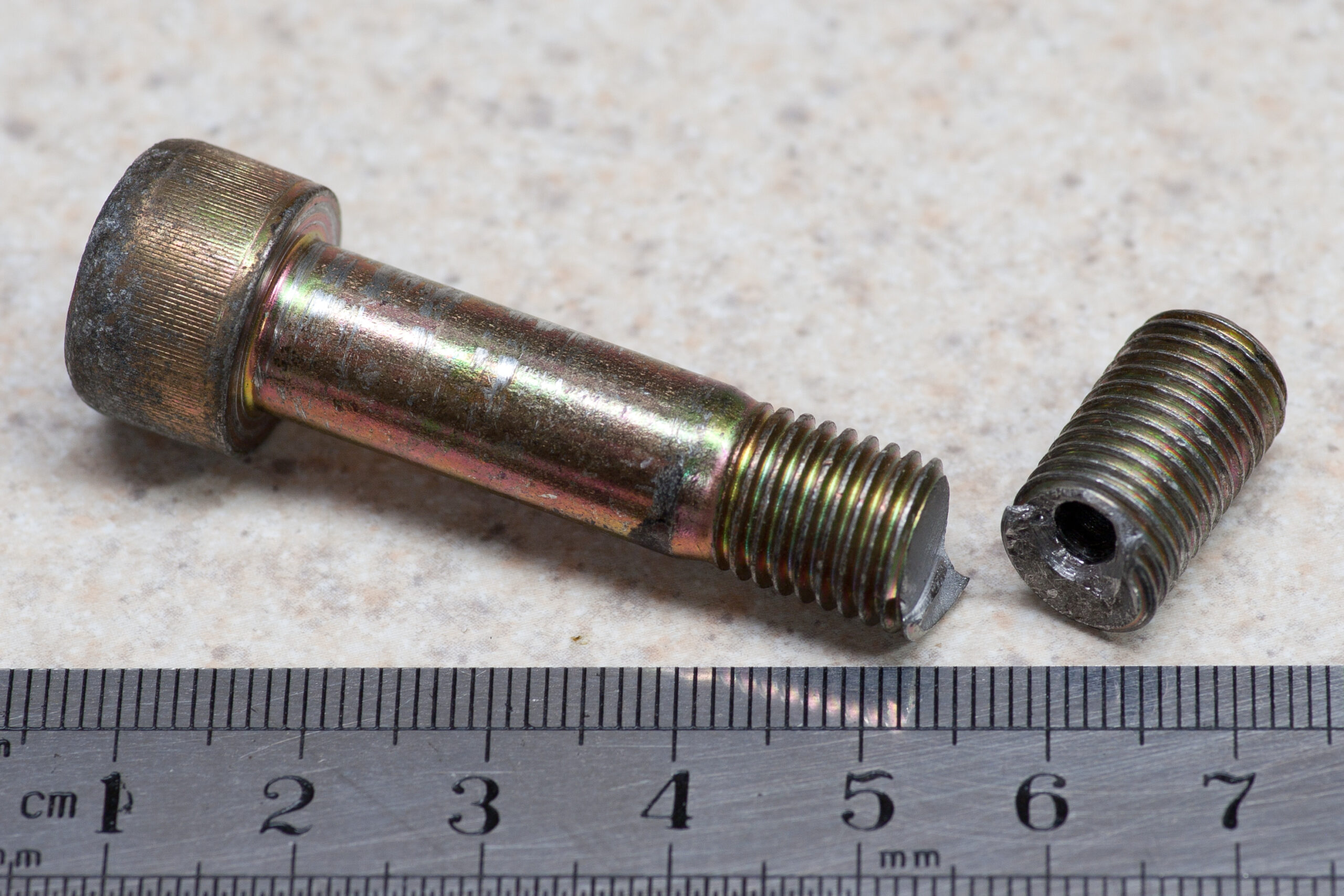 Broken serpentine belt tensioner bolt from my 2006 Honda Civic EX. It had to be drilled then removed with an easy-out.