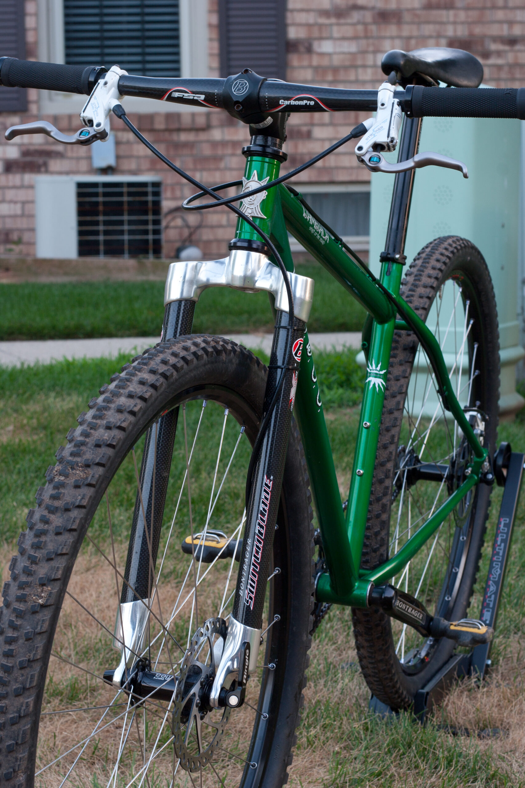 Front view showing the frame, Bontrager Switch Blade Race X Light fork, FSA CarbonPro bar, and moto-setup Hayes Stroker brakes.