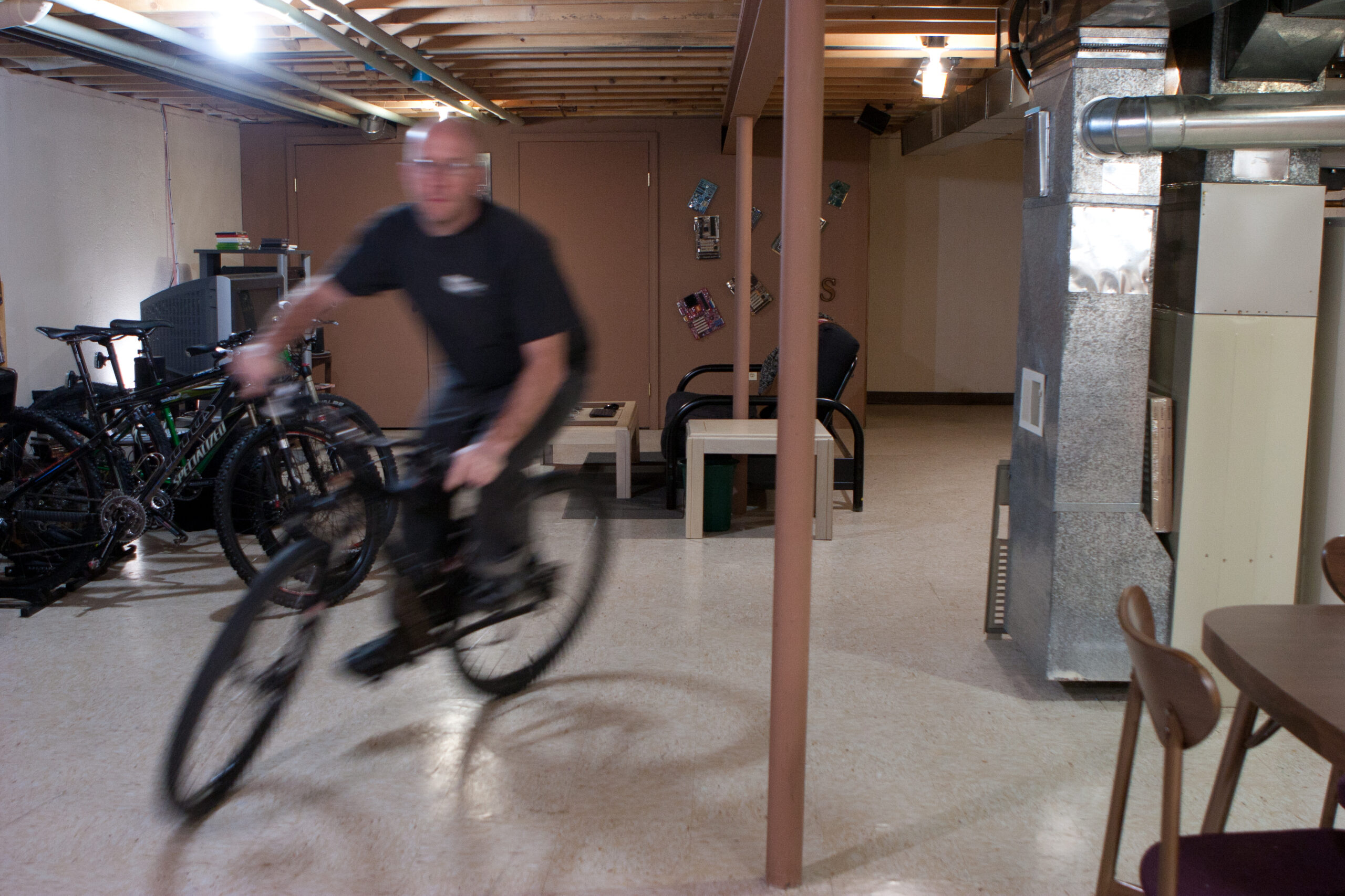 Riding laps of the basement on Danielle's Motobecane. This is right after completing a mile without stopping or even putting a foot down.