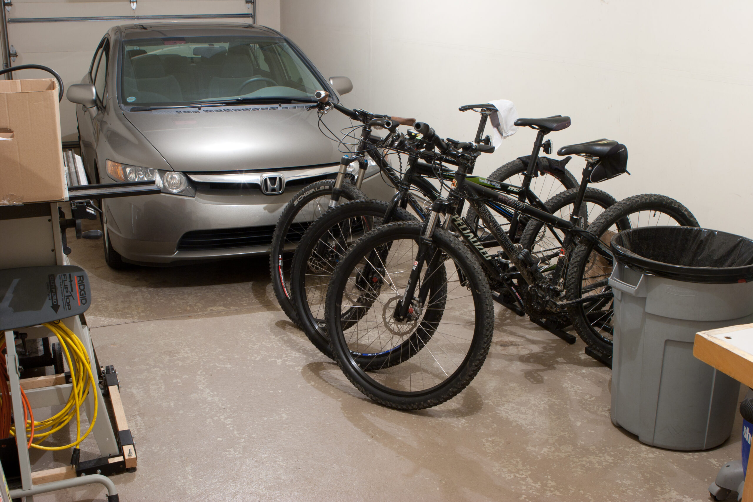 Clean garage after emptying it, sweeping, then hosing it out.