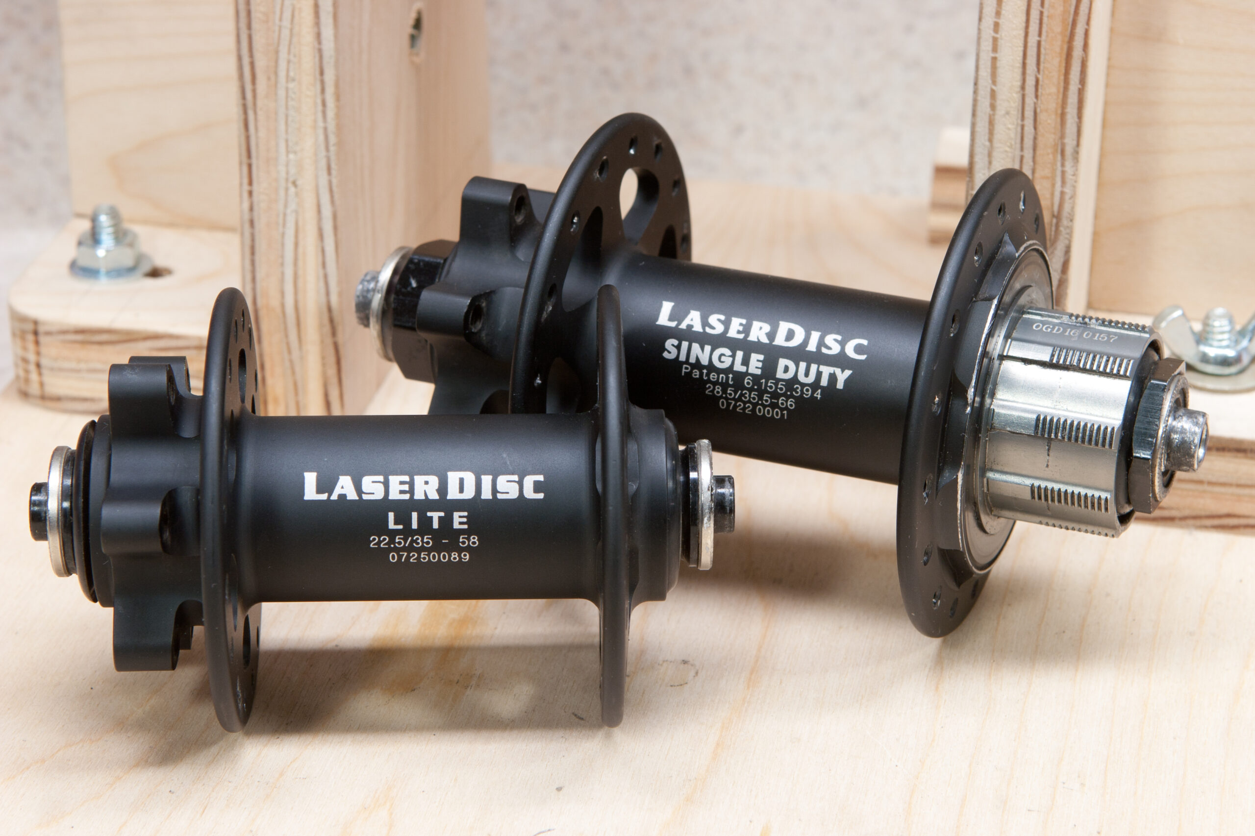 WTB LaserDisc Single Duty and LaserDisc Lite hubs sitting on the truing stand waiting to be built into new wheels.