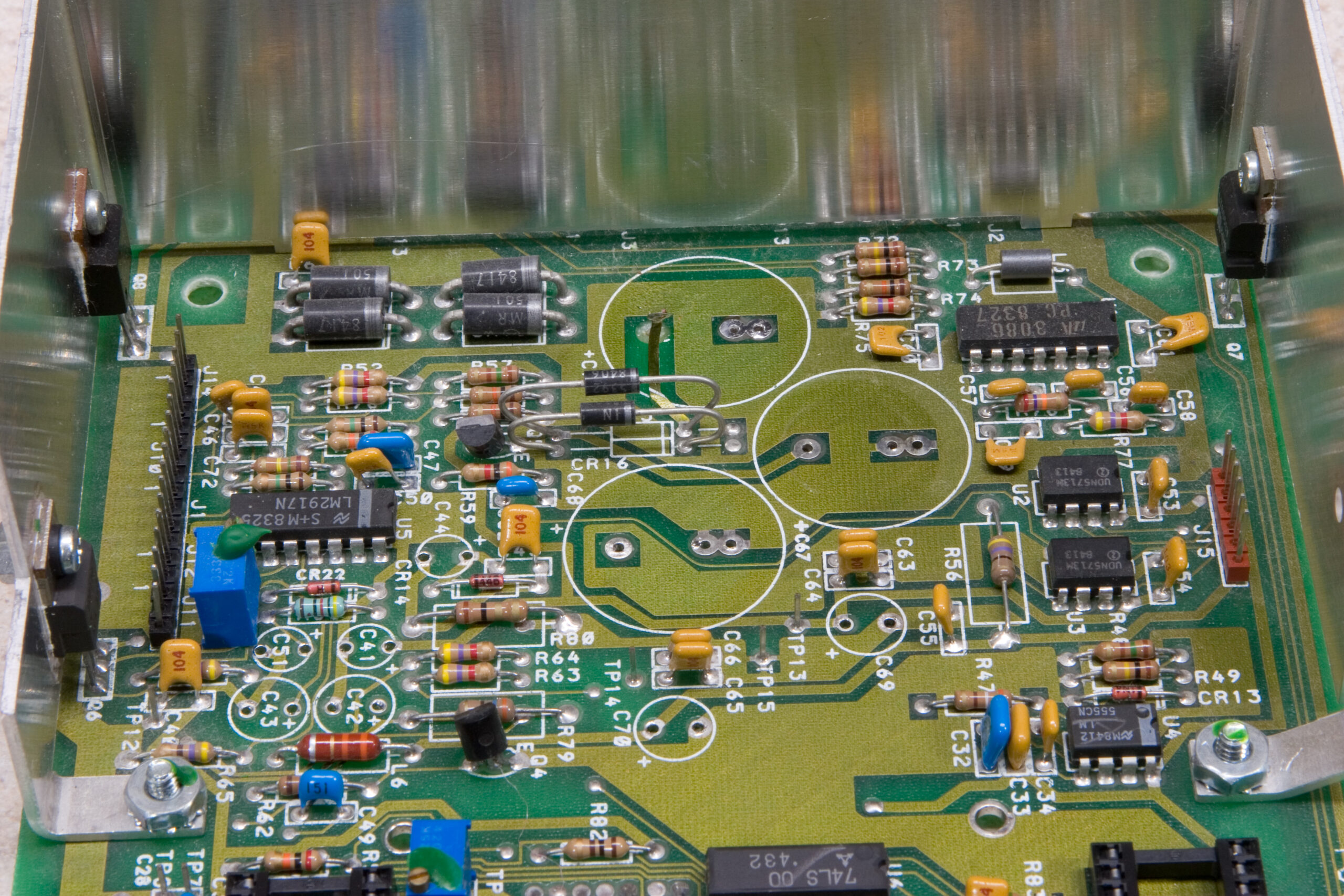 Atari 1050 drive PCB with most of the electrolytic caps removed.