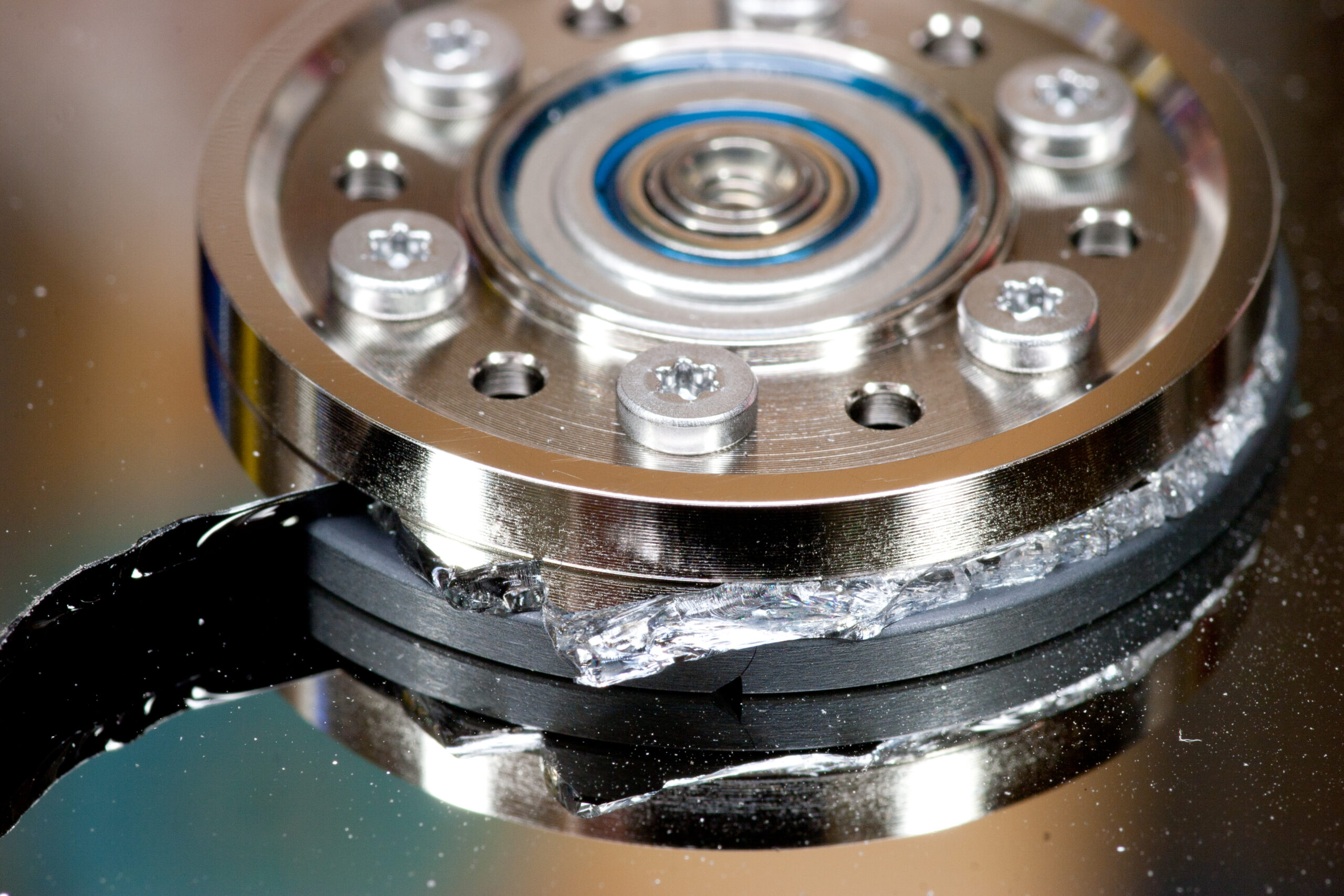 Hard drive platter that inadvertently shattered when disassembling drives to collect neodymium magnets.