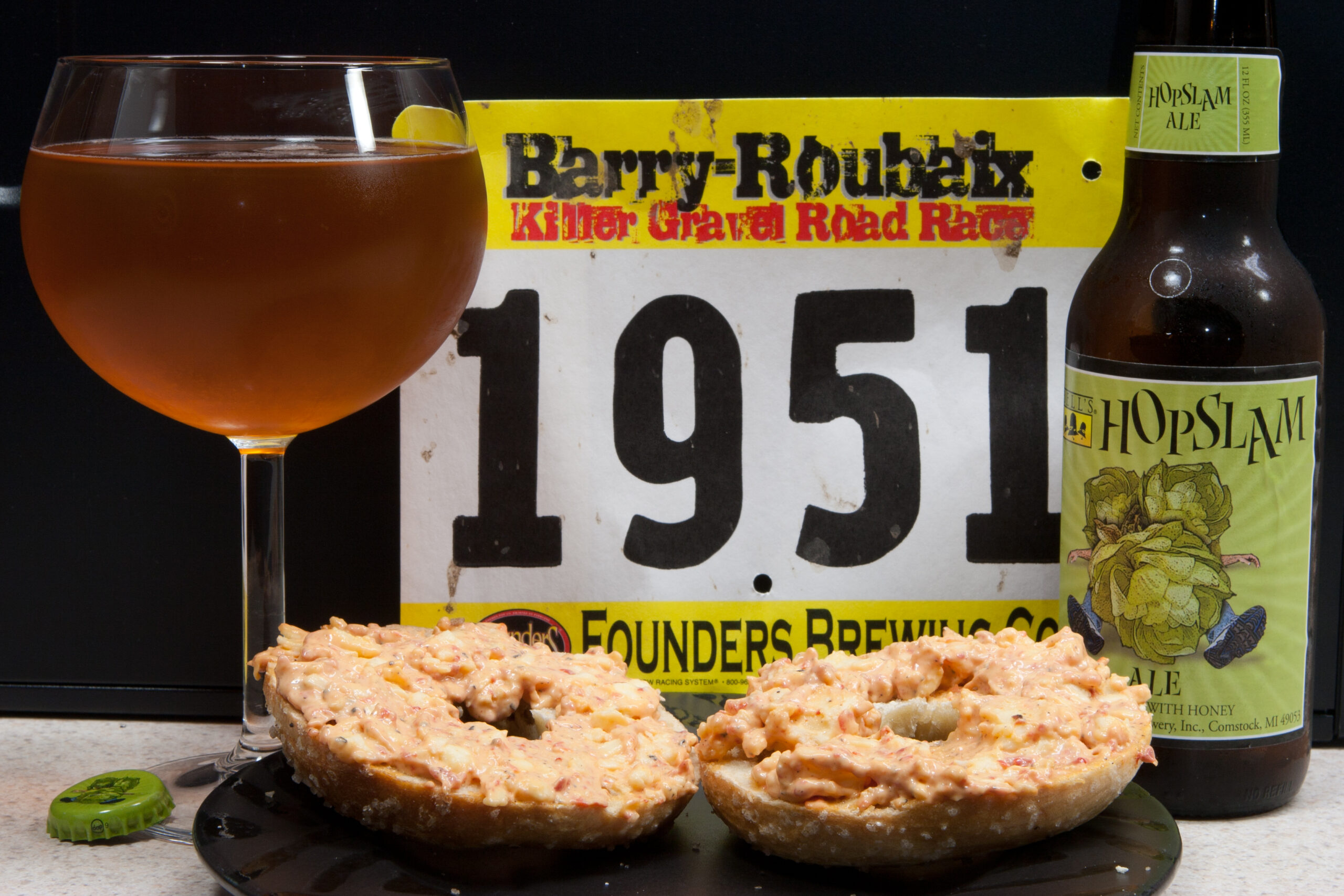 Post Barry-Roubaix snack of pimento cheese spread and a sea salt bagel from Zingerman's ready to be eaten along with a glass of Bell's Hopslam.