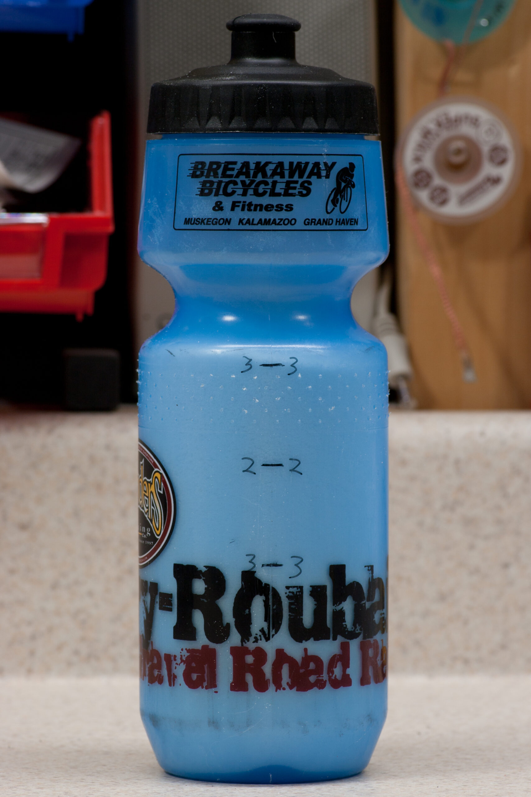 Barry-Roubaix water bottle with half and one-third markings on it, filled with three hours worth of Infinit Nutrition drink mix.