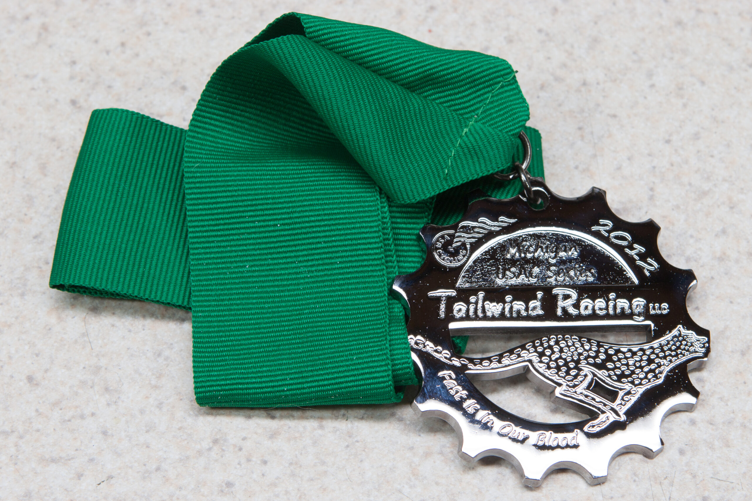 First non-beginner race medal, for fifth place in Sport Men 30-34 at the Tailwind 2012 Stony End Of Summer Classic. Tailwind has nice medals.