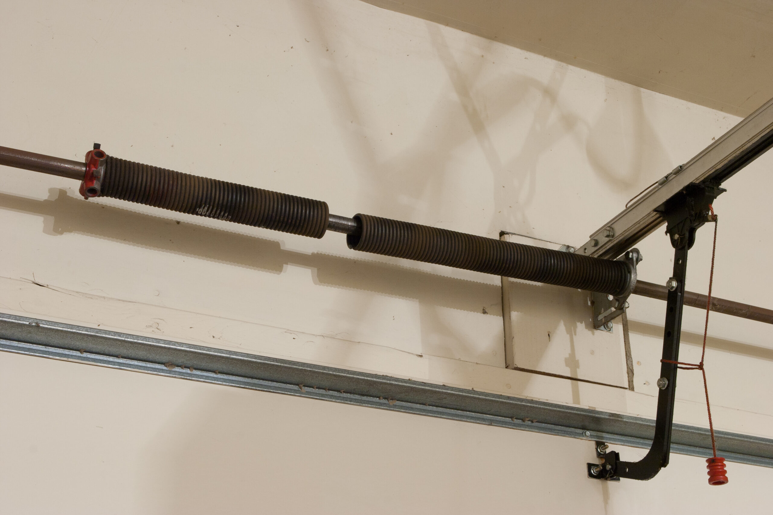 Broken garage door opener spring.
