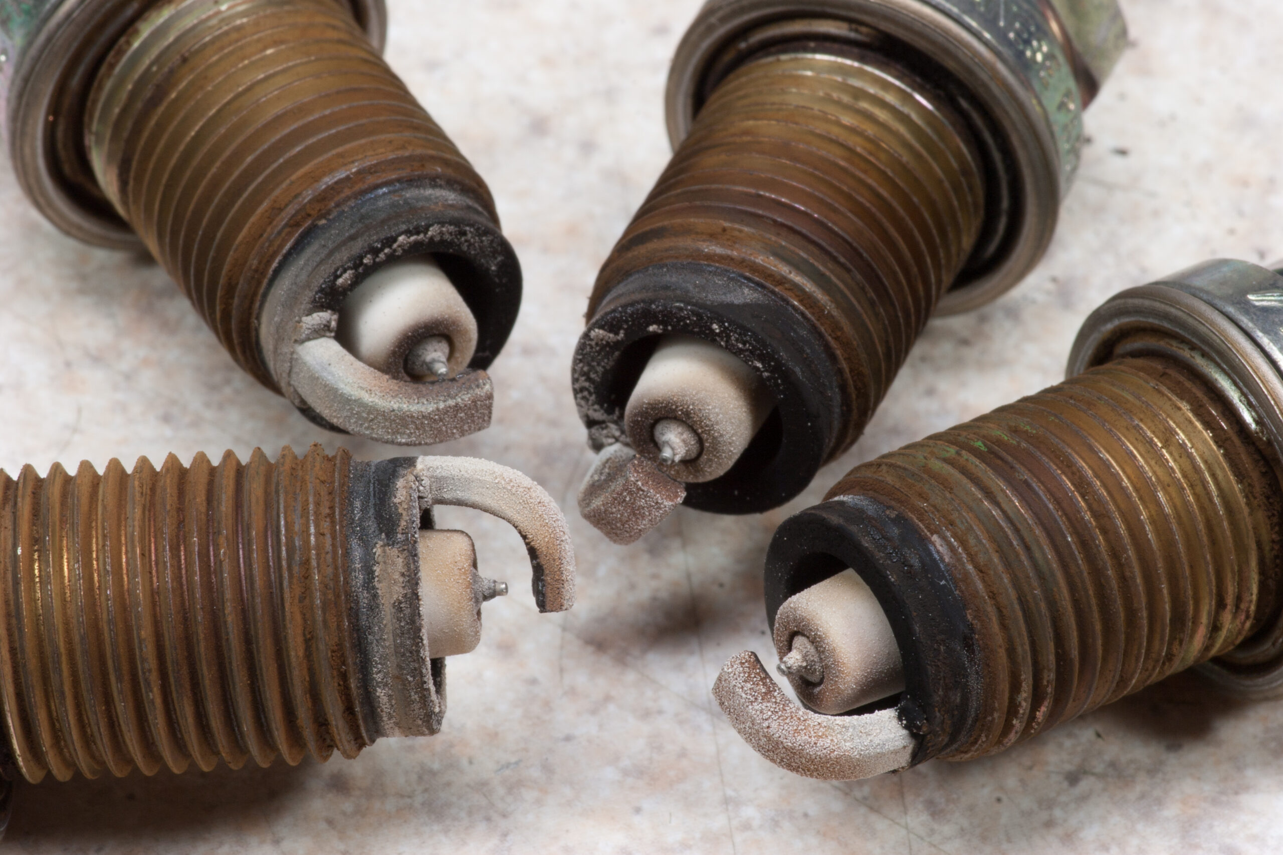 Old spark plugs from the 2006 Honda Civic EX after 166358 miles.