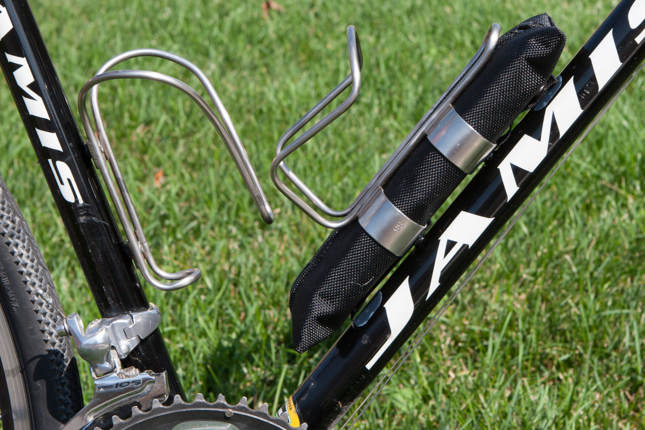 Side view of the King Cage / Tallac Design Kargo Cage showing the UHMW polyethylene tape below the snaps.