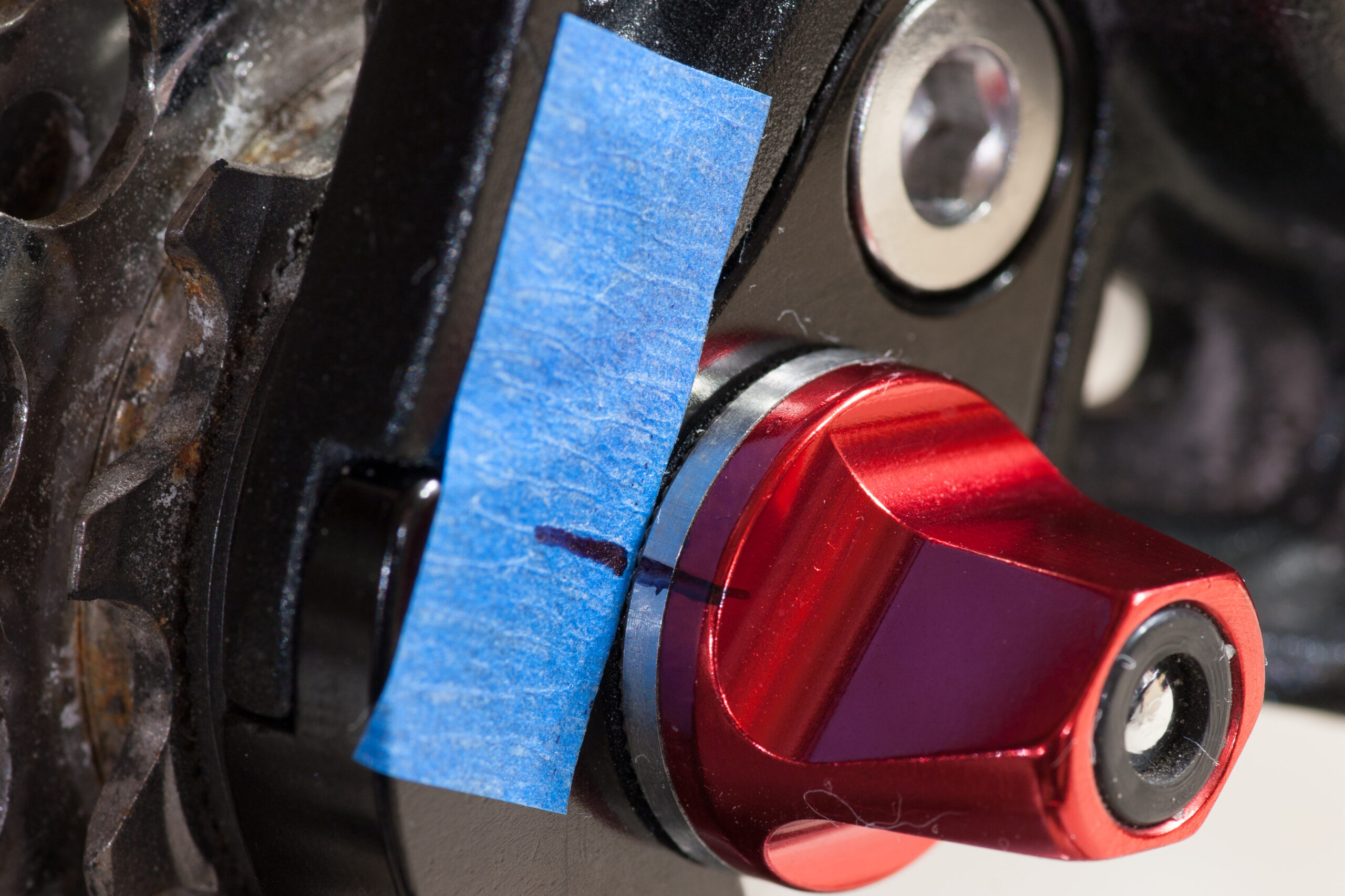 Blue masking tape and a small permanent marker line intended to indicate if the nut on the Salsa skewer is backing off while riding.