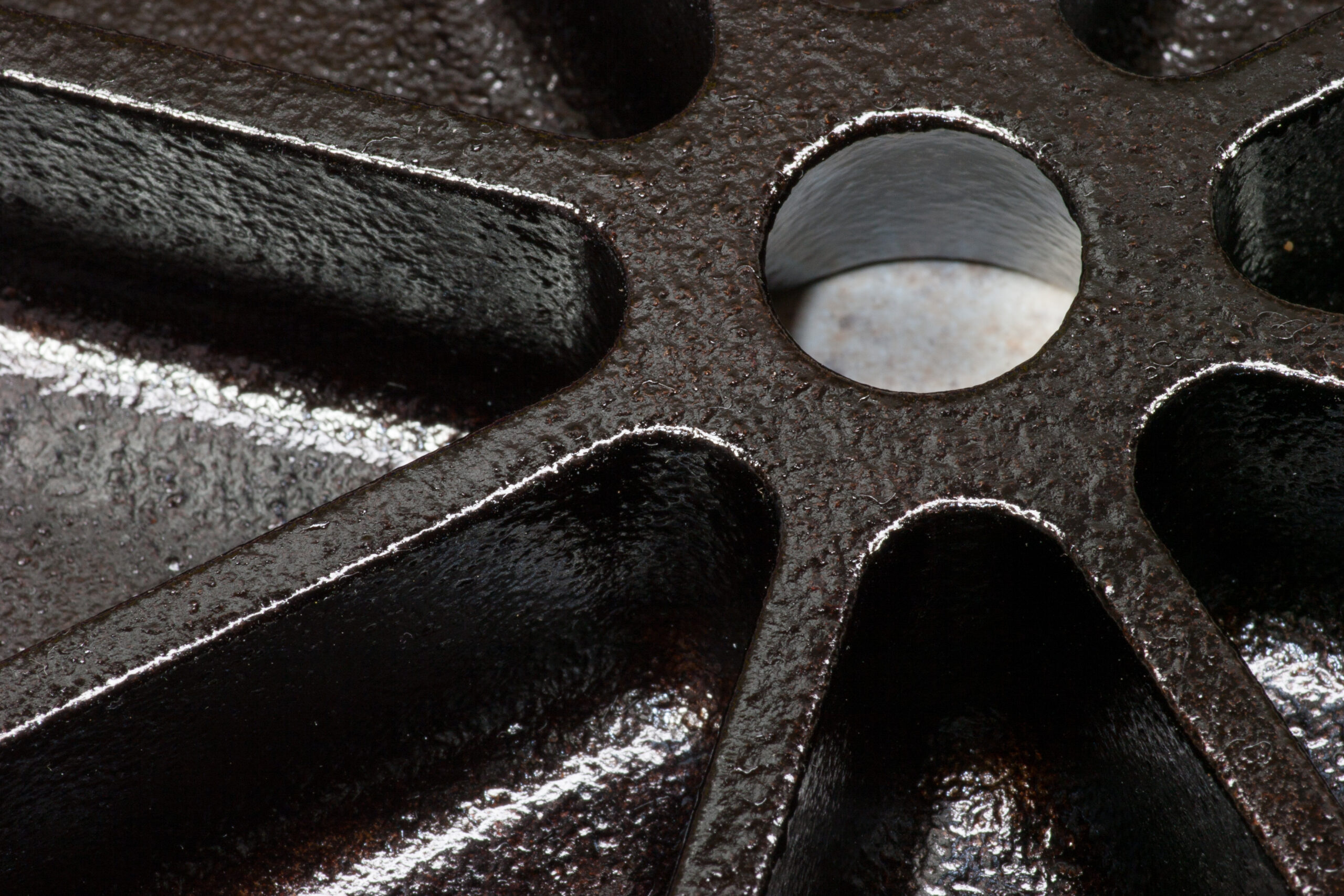Five coats of flaxseed oil seasoning on a Lodge cast iron wedge pan.