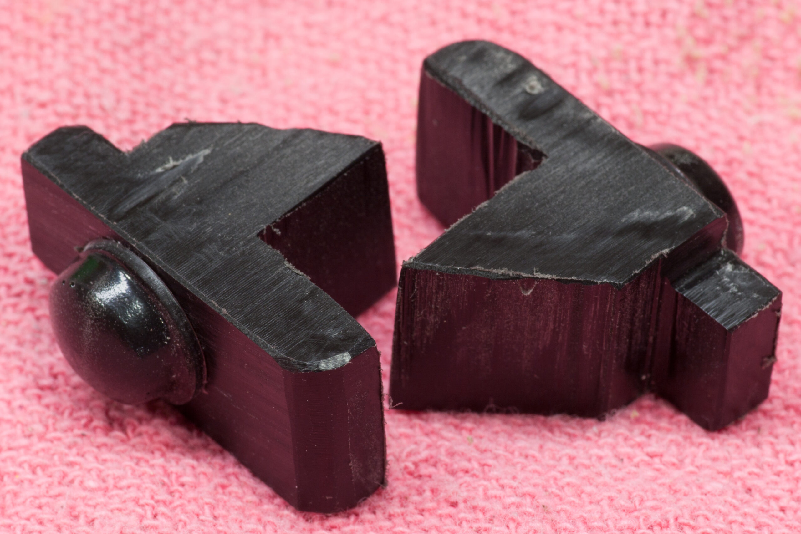 Delrin spacers for holding a GPS in the center console of a 2015 Subaru Outback, with small rubber bumpers.