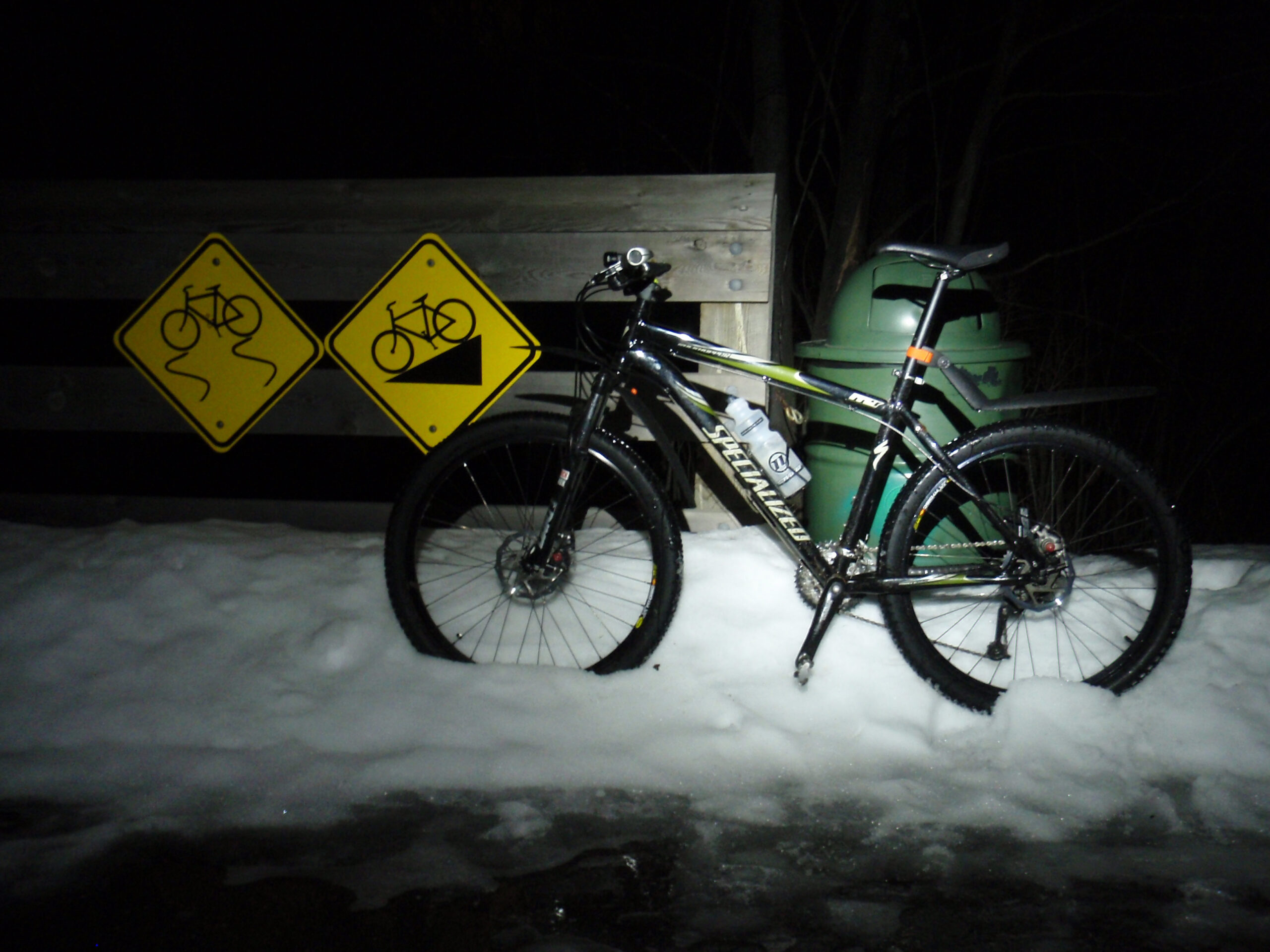 My bike in River Bends Park, at the top of the hill leading down to the bridge over the Clinton River, on an unseasonably warm 54°F (12°C) evening. While the snow was rapidly melting, there was quite a bit left, along with lots of ice on paths.