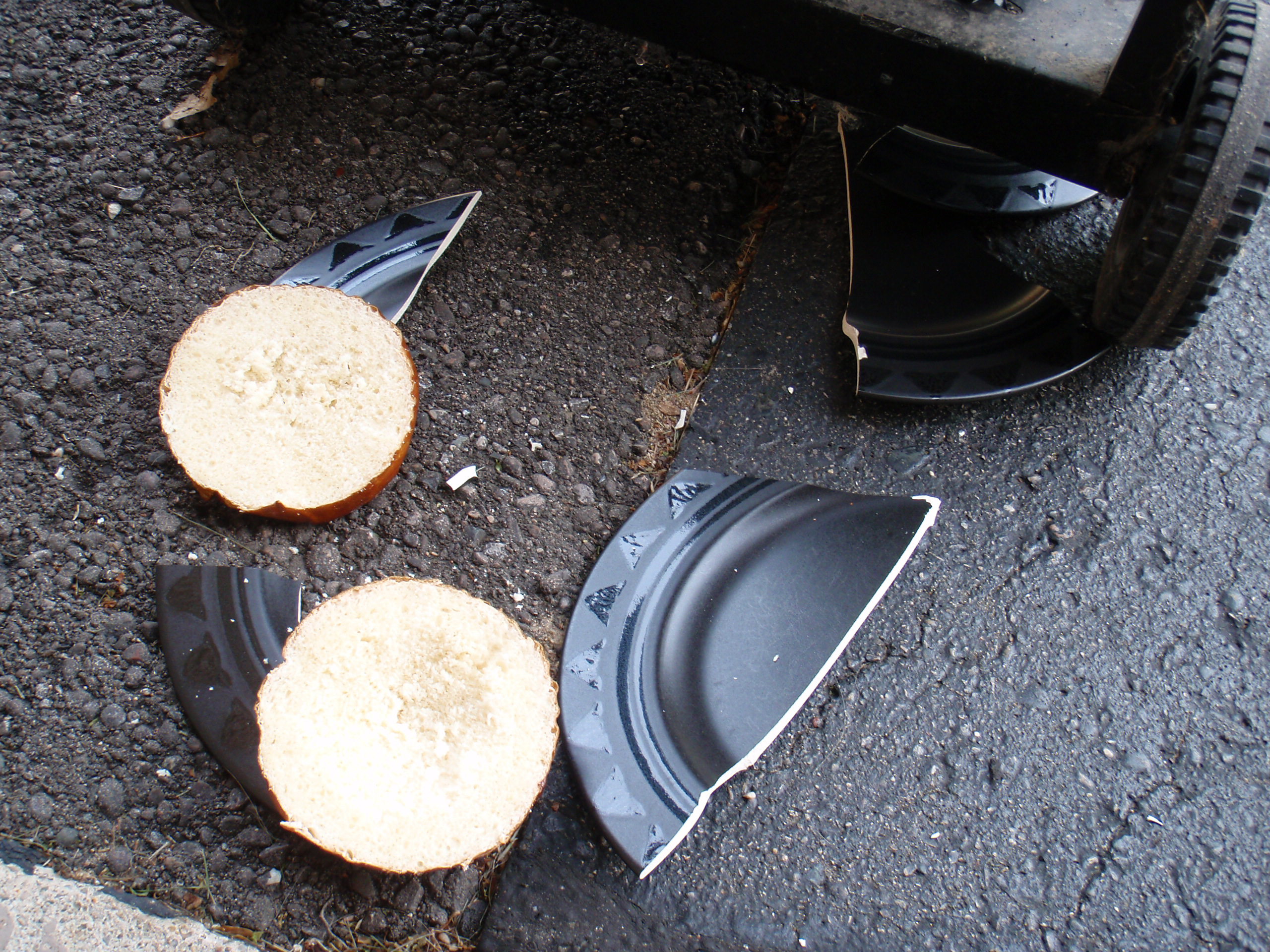 Broken plate from after one side table on the BBQ fell. I'm very disappointed by this.