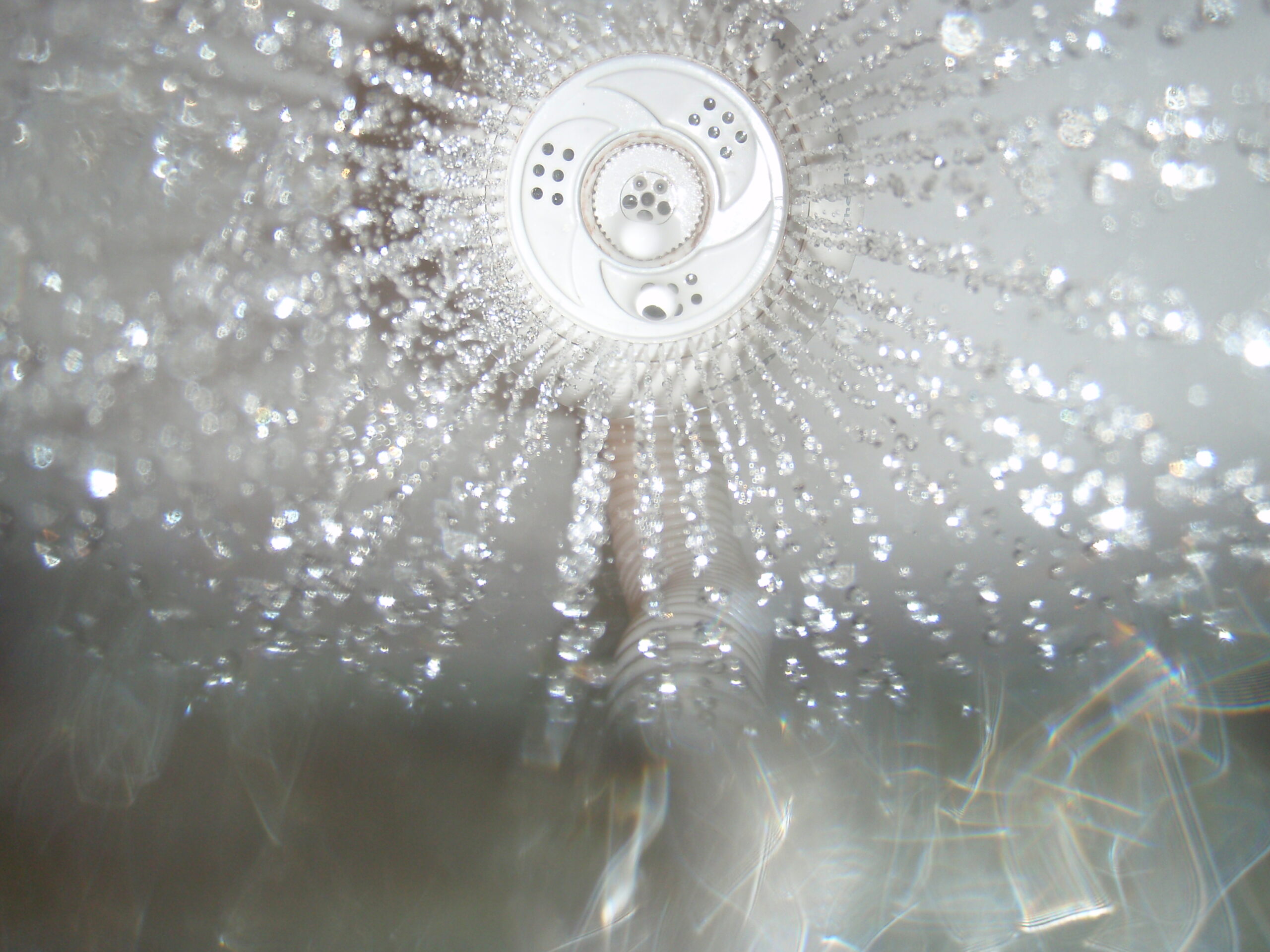 My shower head, taken from inside of the cone of spray. One of the first photos from my new Olympus Stylus 850 SW, it was taken in the shower after a bike ride.