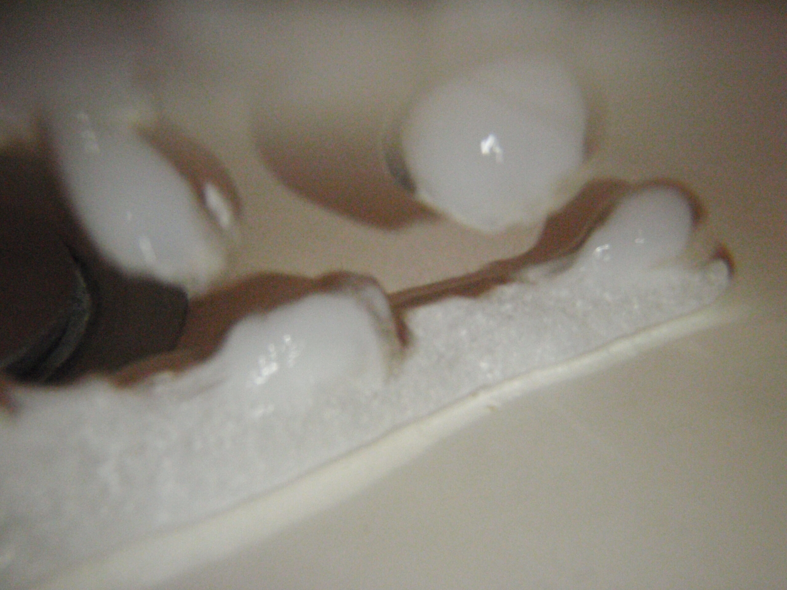 Dry ice in hot water in the bathroom sink, taken from under water with LED macro illumination. (1 of 2)