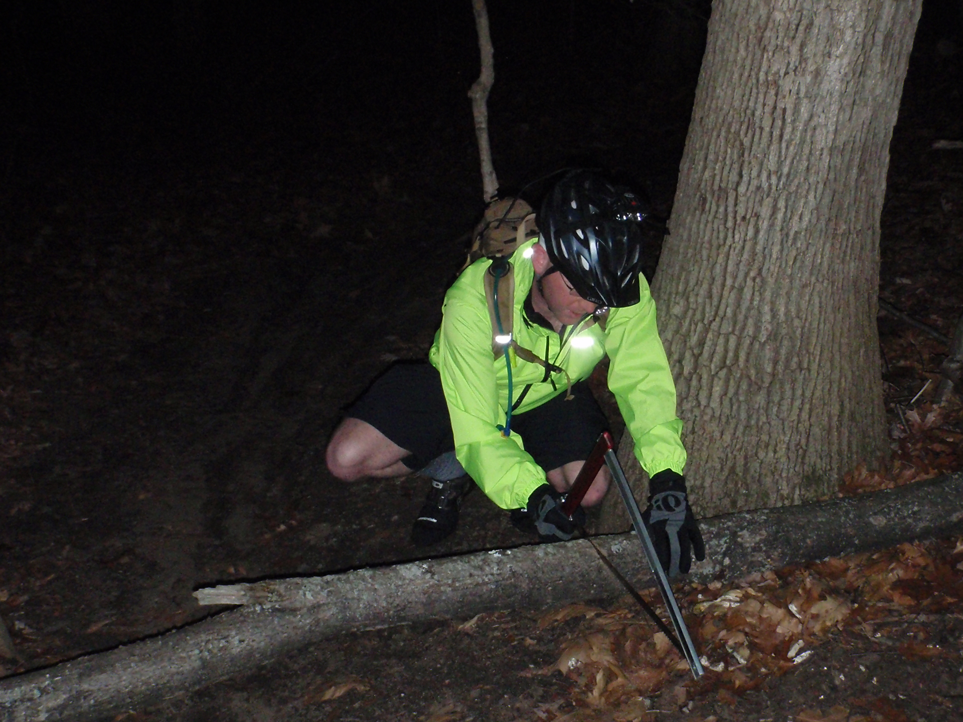Cutting the downed tree at River Bends so it could be moved off the trail.